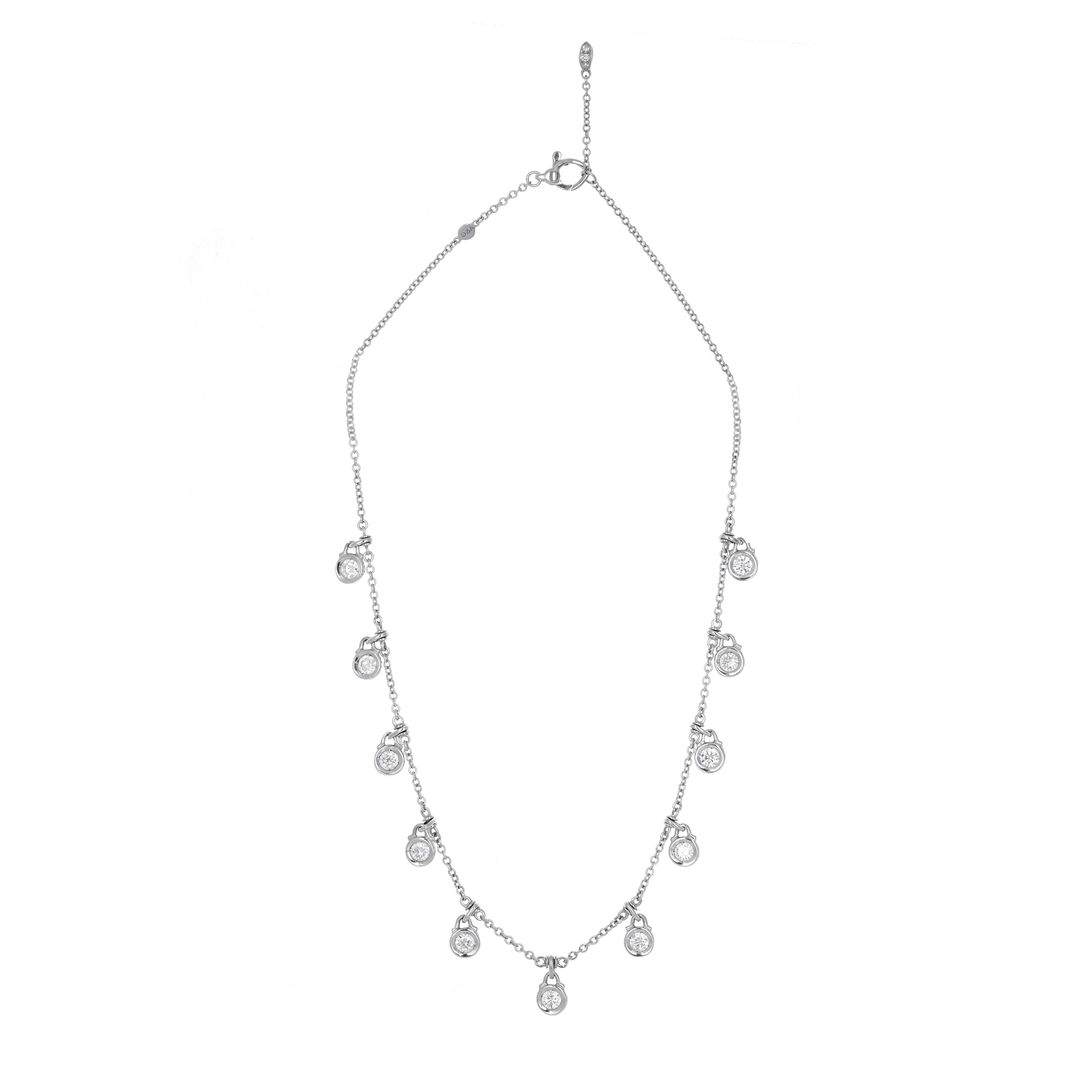 18 karat white gold diamond drop necklace. This necklace has 11 round brilliant white diamonds weighing a total of 1.70 carats. Each diamond is bezel set and has movement. The necklace can be worn 15 or 16 inches.