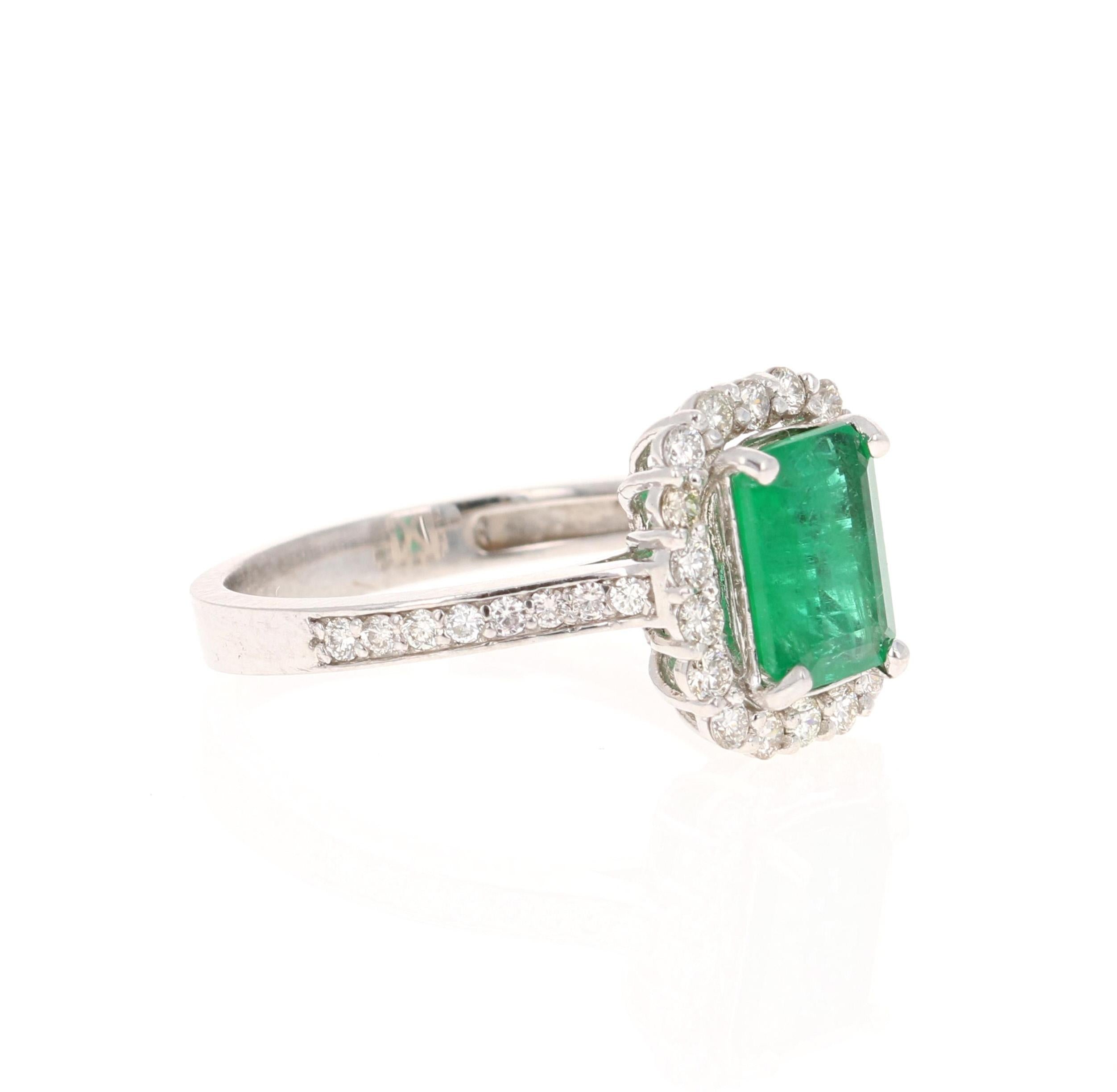 This ring has a Emerald Cut Emerald that weighs 1.24 carat and also has 36 Round Cut Diamonds that weigh 0.46 carats. The total carat weight of the ring is 1.70 carats. The clarity and color of the diamonds are VS-H. 

The ring is curated in 14K