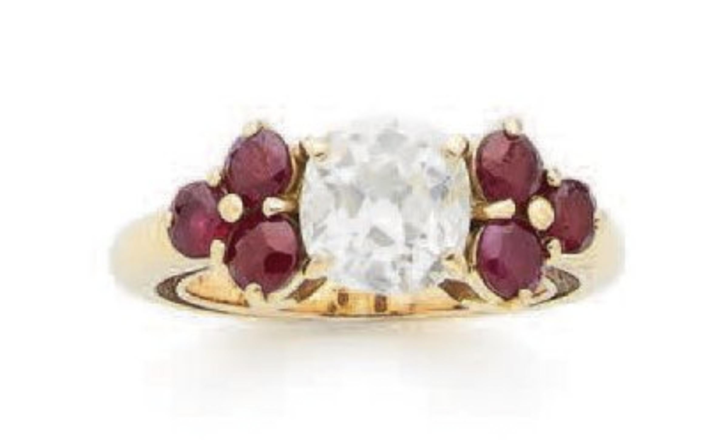 Discover refined elegance with our exquisite Ruby and Diamond Ring. This captivating piece showcases a central 1.7 carat square-cut diamond, known for its pristine white color and VS1 clarity. The diamond's brilliance is enhanced by its precise cut,