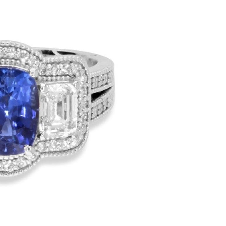 Women's 1.70 Carat Oval Cut Blue Sapphire and Baguette Diamond Ring in 18k White Gold For Sale