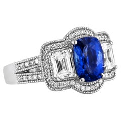 1.70 Carat Oval Cut Blue Sapphire and Baguette Diamond Ring in 18k White Gold