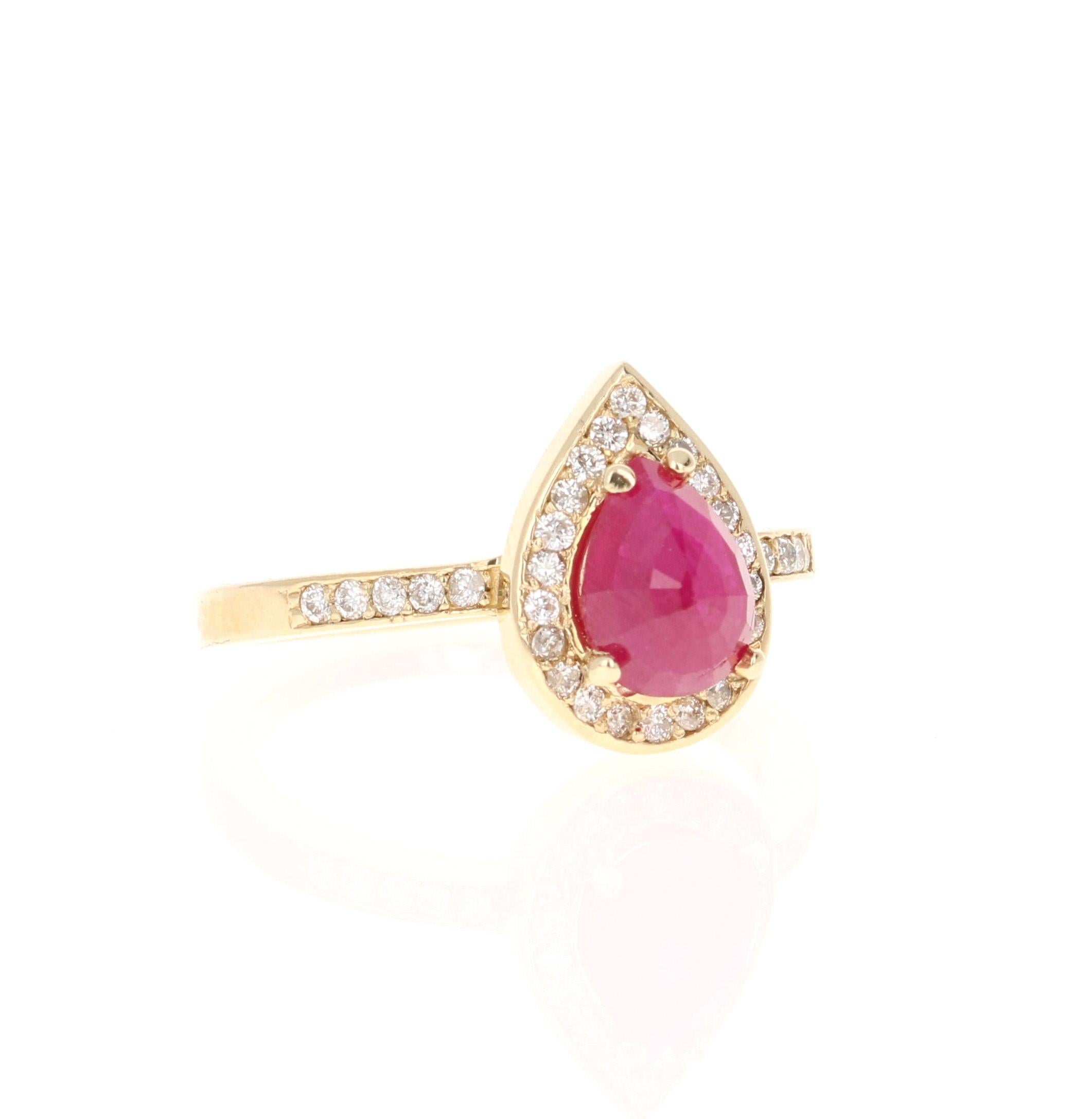 This ring has a pretty pear cut Ruby that weighs 1.39 carats and has 32 round cut diamonds that weigh 0.31 carats, (clarity: SI, color: F) The Pear Cut Ruby is natural but heated as per industry standards and measures at approximately 8 mm x 6