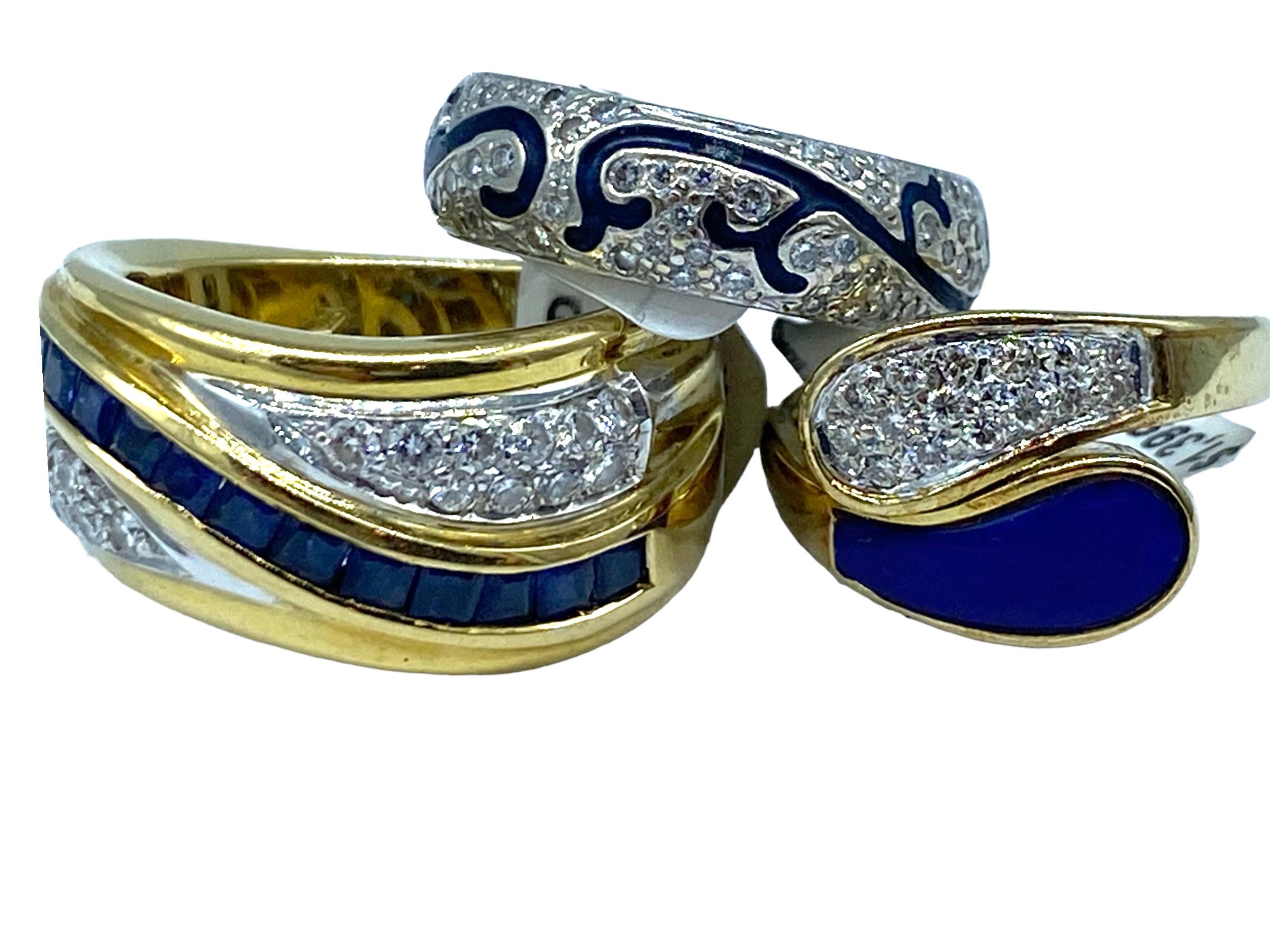 
Princess Sapphire and Diamond Channel, 1.70 total carat weight.

This retro style ring is 11.50 mm wide featuring a center channel set princess row of 14 blue sapphires set in 14 karat yellow gold. Color of sapphires are superior and matched.
 The
