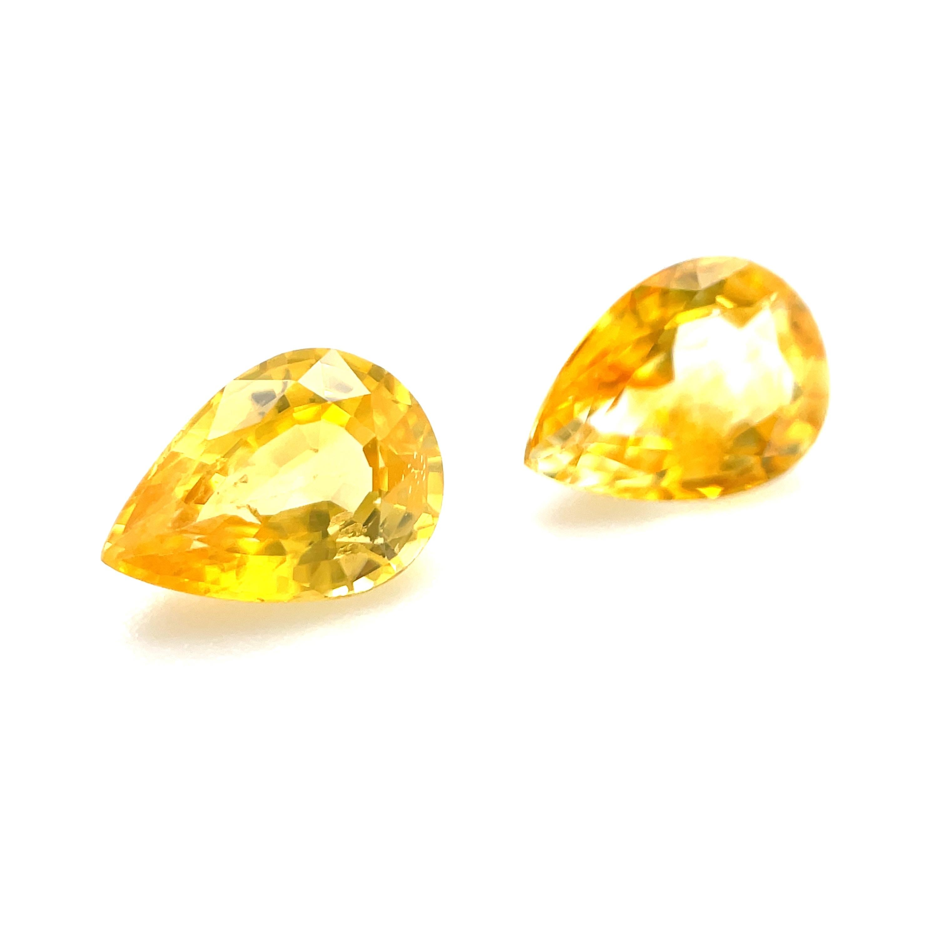This beautifully matched pair of lemon drop yellow sapphires will make a gorgeous pair of earrings! Weighing 1.70 carats total, they have bright, lemon yellow color with rich golden highlights. They are eye clean and have lovely proportions that