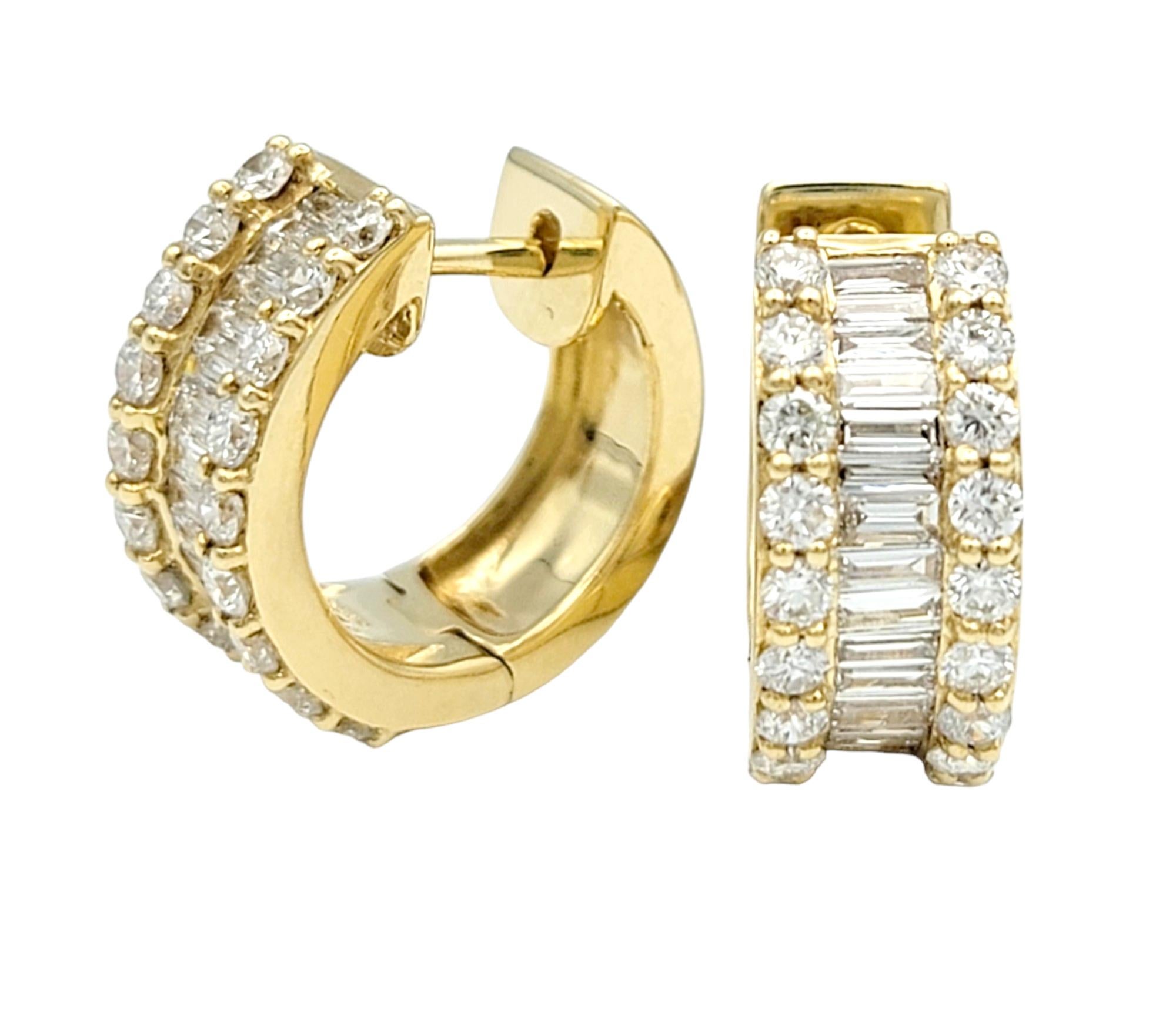 These dazzling diamond huggie hoop earrings, set in radiant 18 karat yellow gold, exude a captivating and refined elegance. The center of each hoop is adorned with a row of baguette diamonds, adding a sleek and contemporary element to the design.