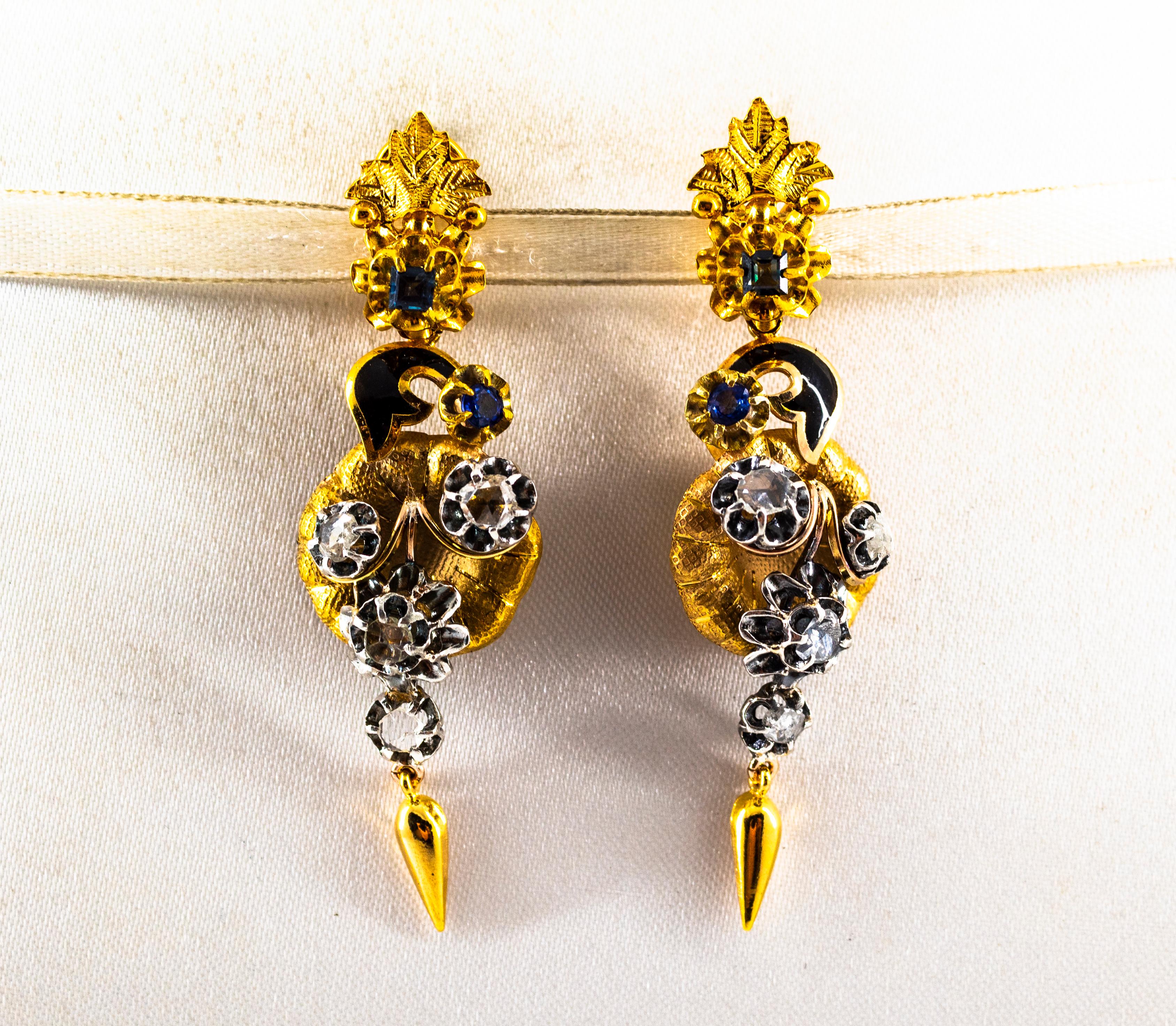 These Earrings are made of 9K Yellow Gold and Sterling Silver.
These Earrings have 0.90 Carats of White Rose Cut Diamonds.
These Earrings have 0.80 Carats of Blue Sapphires.
These Earrings have also Black Enamel.
All our Earrings have pins for