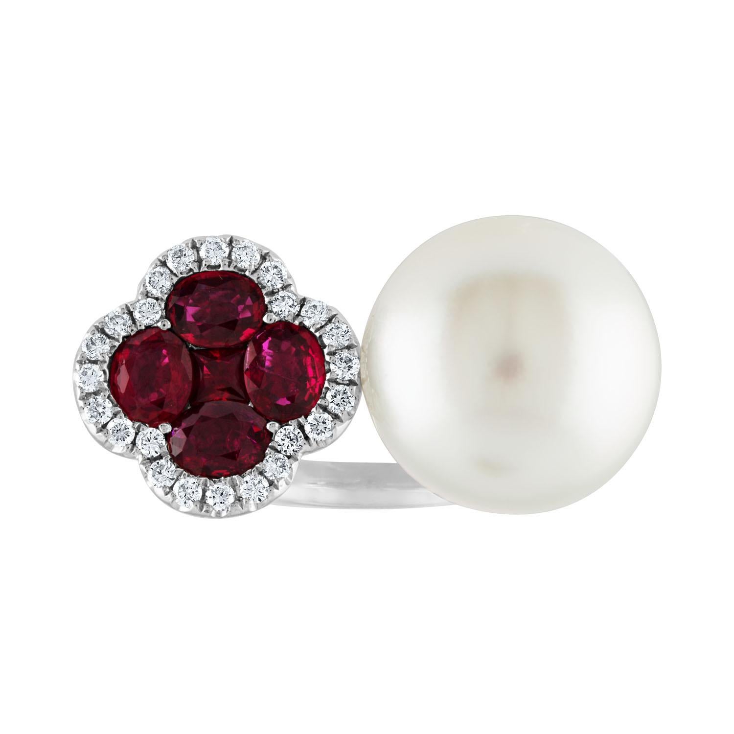 Between The Finger Ring
The ring is 18K White Gold
There are 1.70 Carats in Rubies
There are 0.30 Carats in Diamonds G/H VS/SI
The South Sea Pearl is 14.50MM
The ring is a size 6.75, sizable.
The ring weighs 10.7 grams