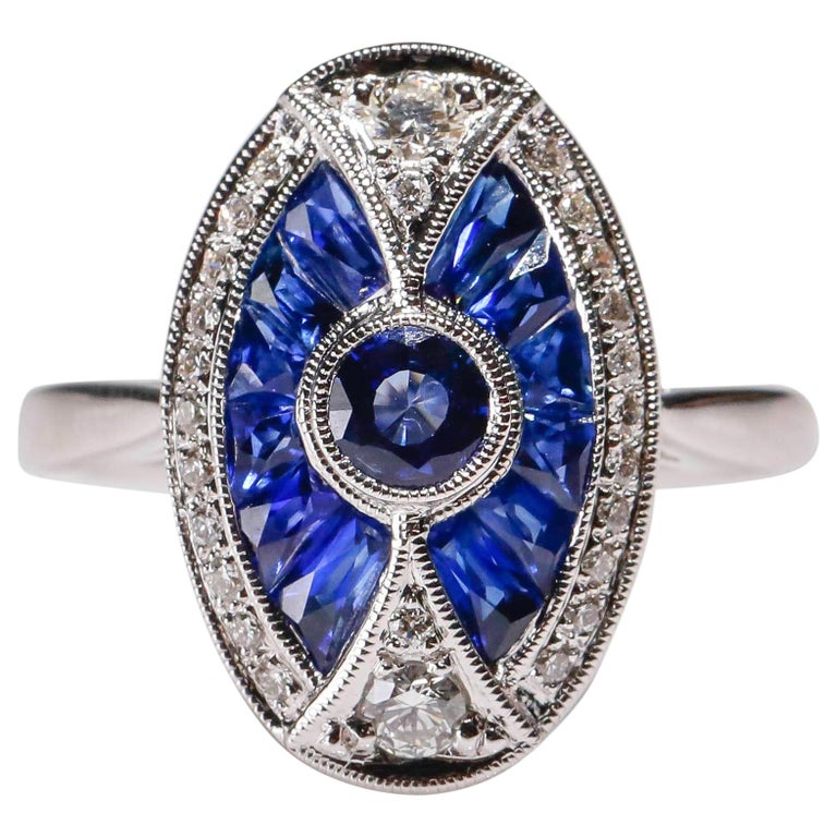 Bague en or blanc 18 carats joli saphir de 1.2 cts et diamants