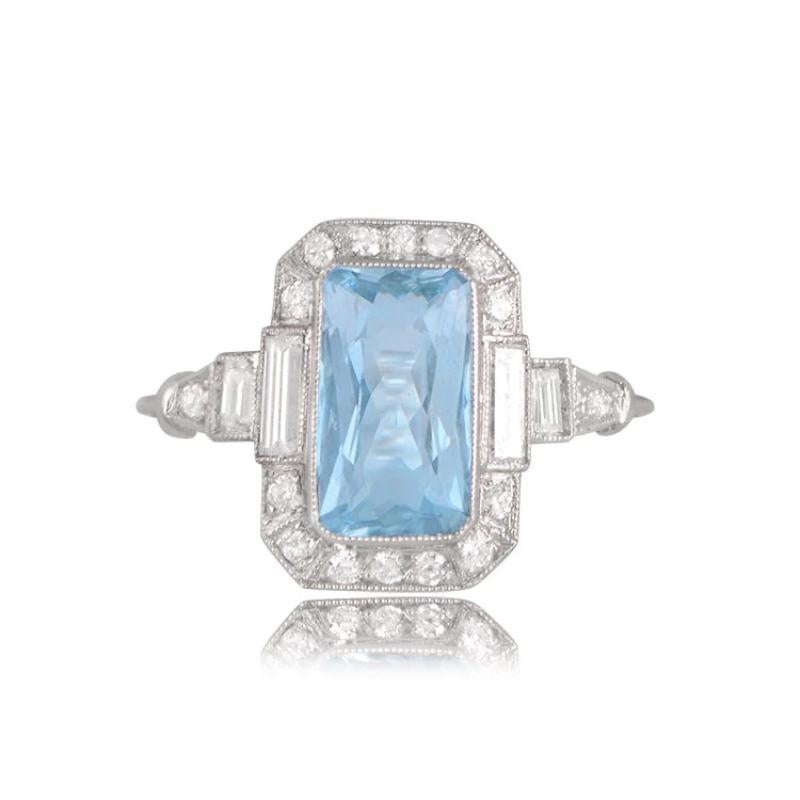 
A striking aquamarine ring featuring a 1.70-carat rectangular cushion cut aquamarine with vivid teal saturation. The center stone is bordered by a row of old European cut diamonds and two perfectly shaped baguette-cut diamonds. This ring is