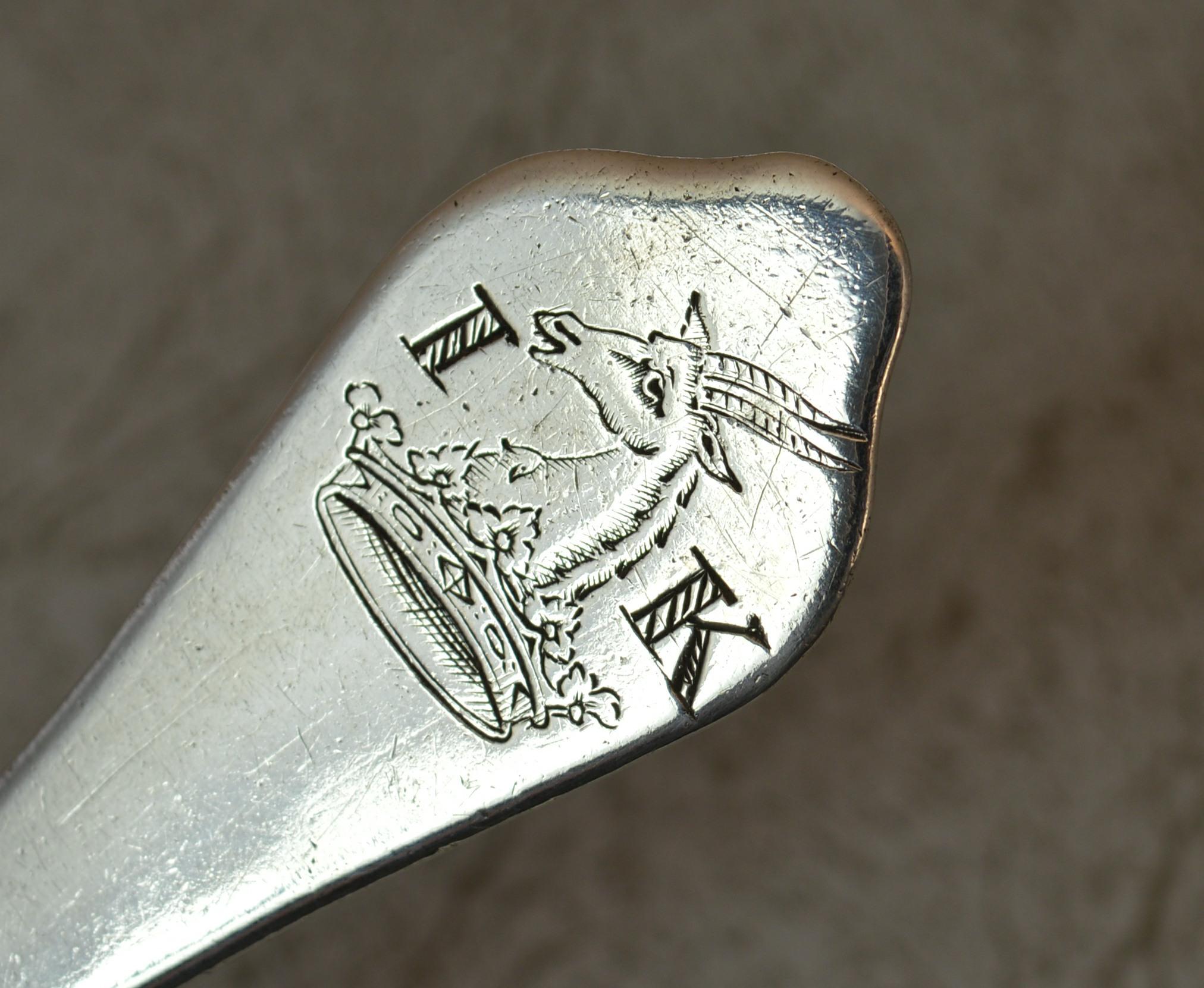 A rare English made table spoon in sterling silver.
Trefid shape to the top of the handle with rat tail to reverse of bowl. Family crest to the reverse of the handle.
Circa 1690.
Hallmarks ; to reverse of handle, quite worn
Weight ; 59 grams 
Size ;