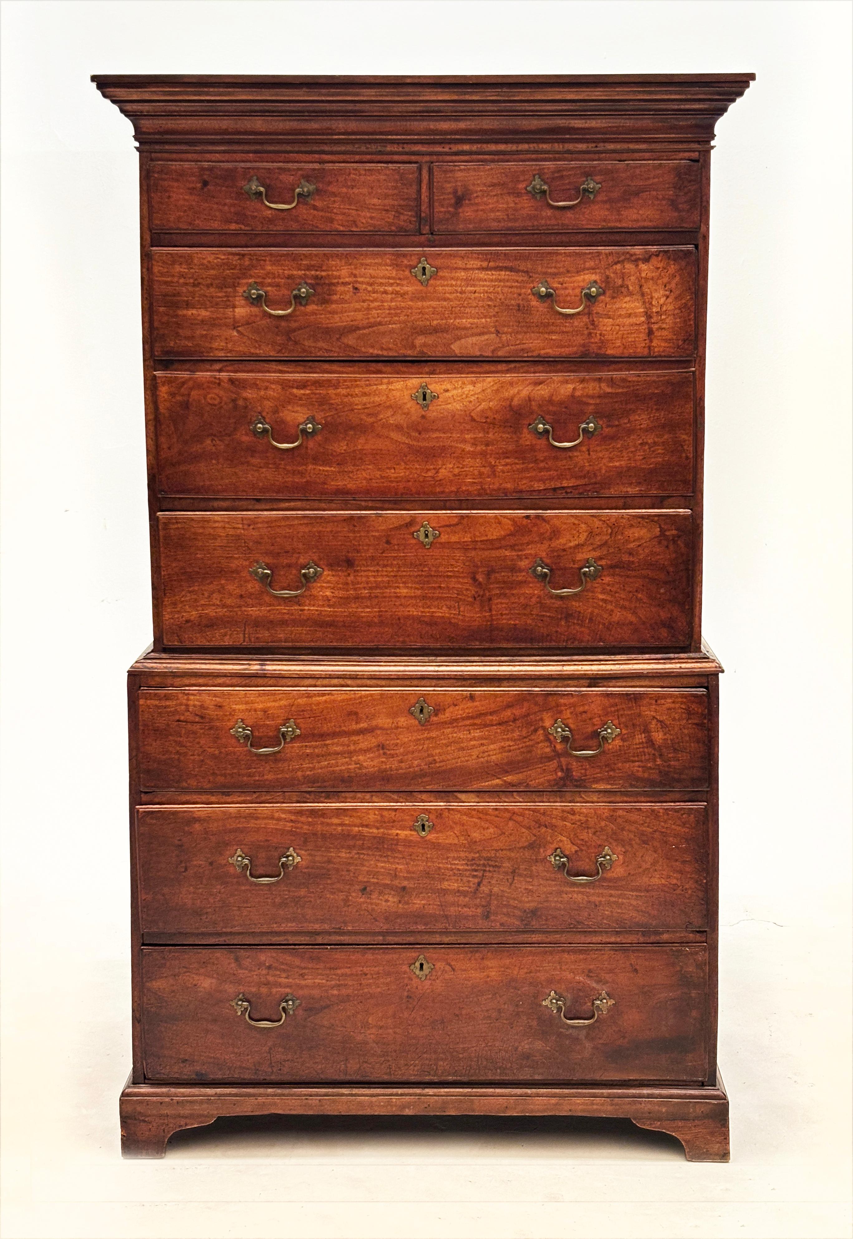 There are times when words just don't suffice in describing a spectacular piece of historic furniture. This is perhaps one of those examples. This early 18th century, walnut George II, 2-pc. chest of drawers is nothing short of stunning and comes