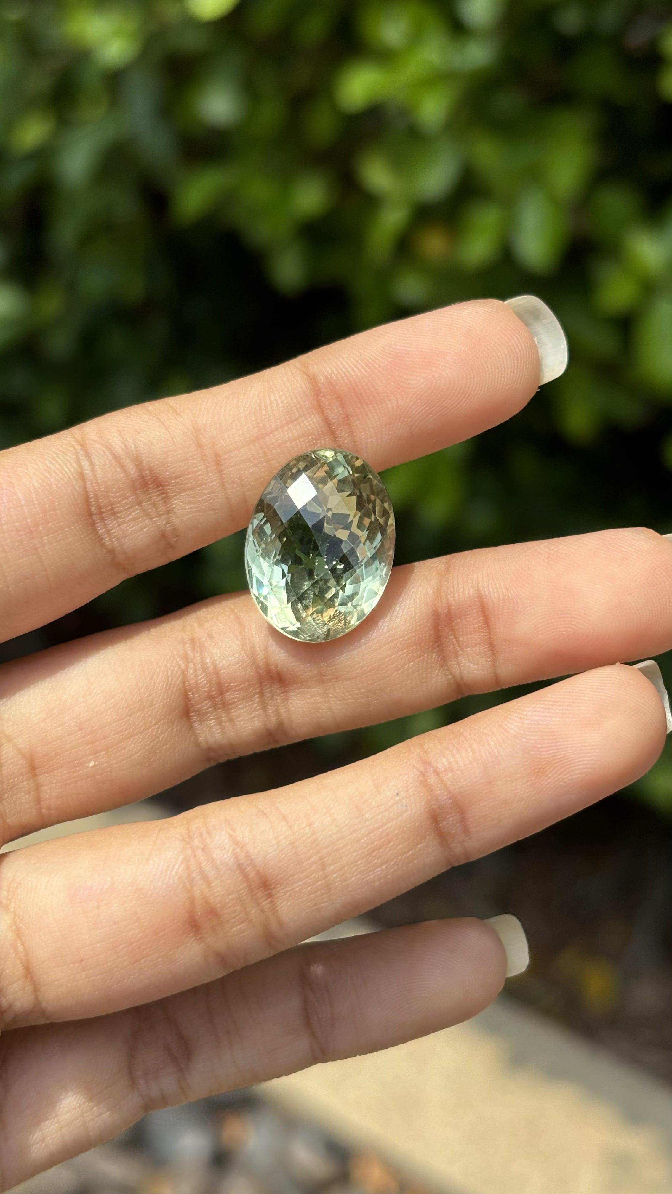 A gorgeous 17.01 Carat Quartz gemstone. It is completely natural and it is a clean stone.  The quartz has a unique and breath-taking  green color that is sure to allure you at first sight! It is cut to perfection in a distinct and fancy oval