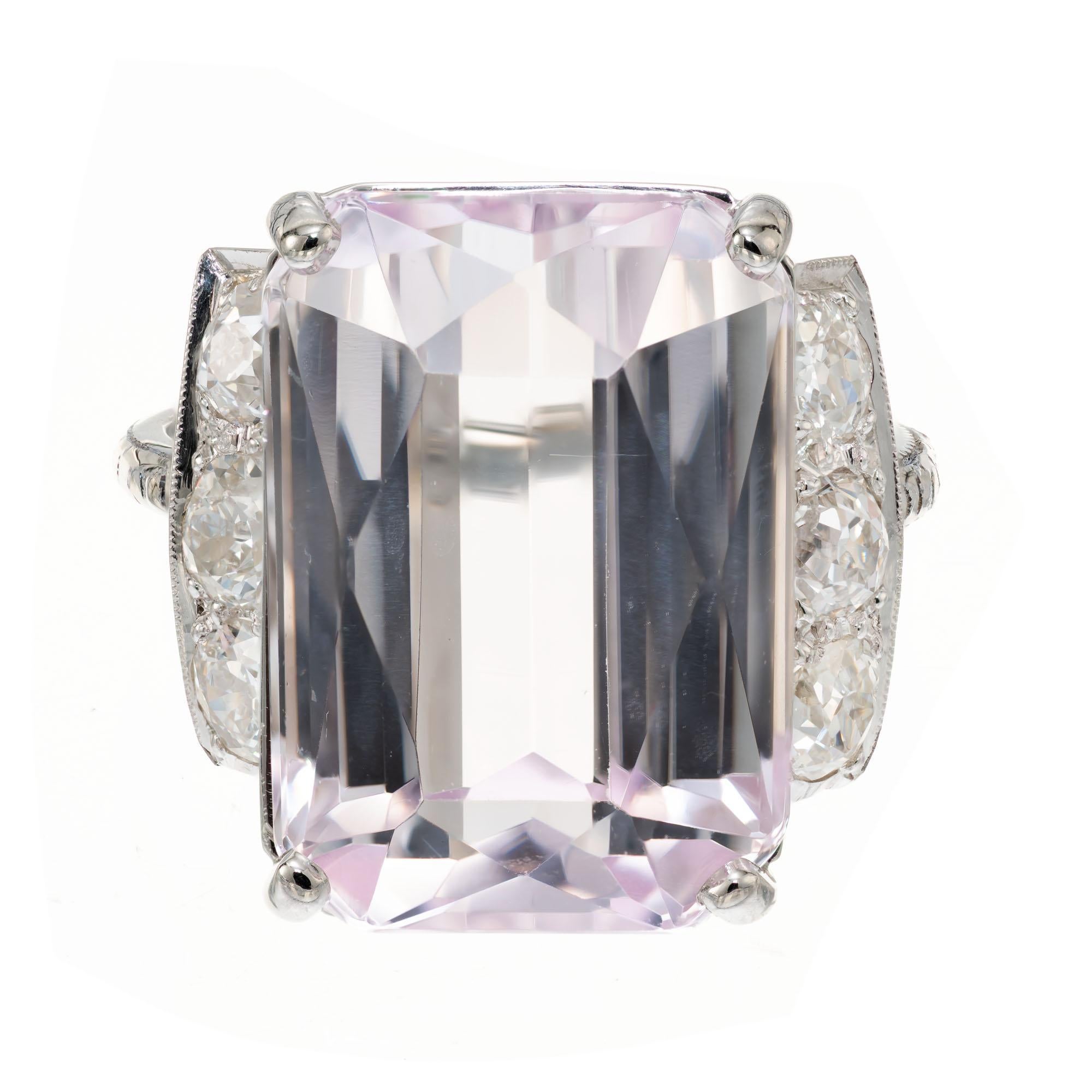 Vintage 1930's Art Deco carat kunzite and diamond ring. 17.01 carat emerald cut pink kunzite center stone in a platinum 18k white gold cocktail setting with 6 old mine cut accent diamonds. The crown is platinum and the shank is 18k white gold.  

1