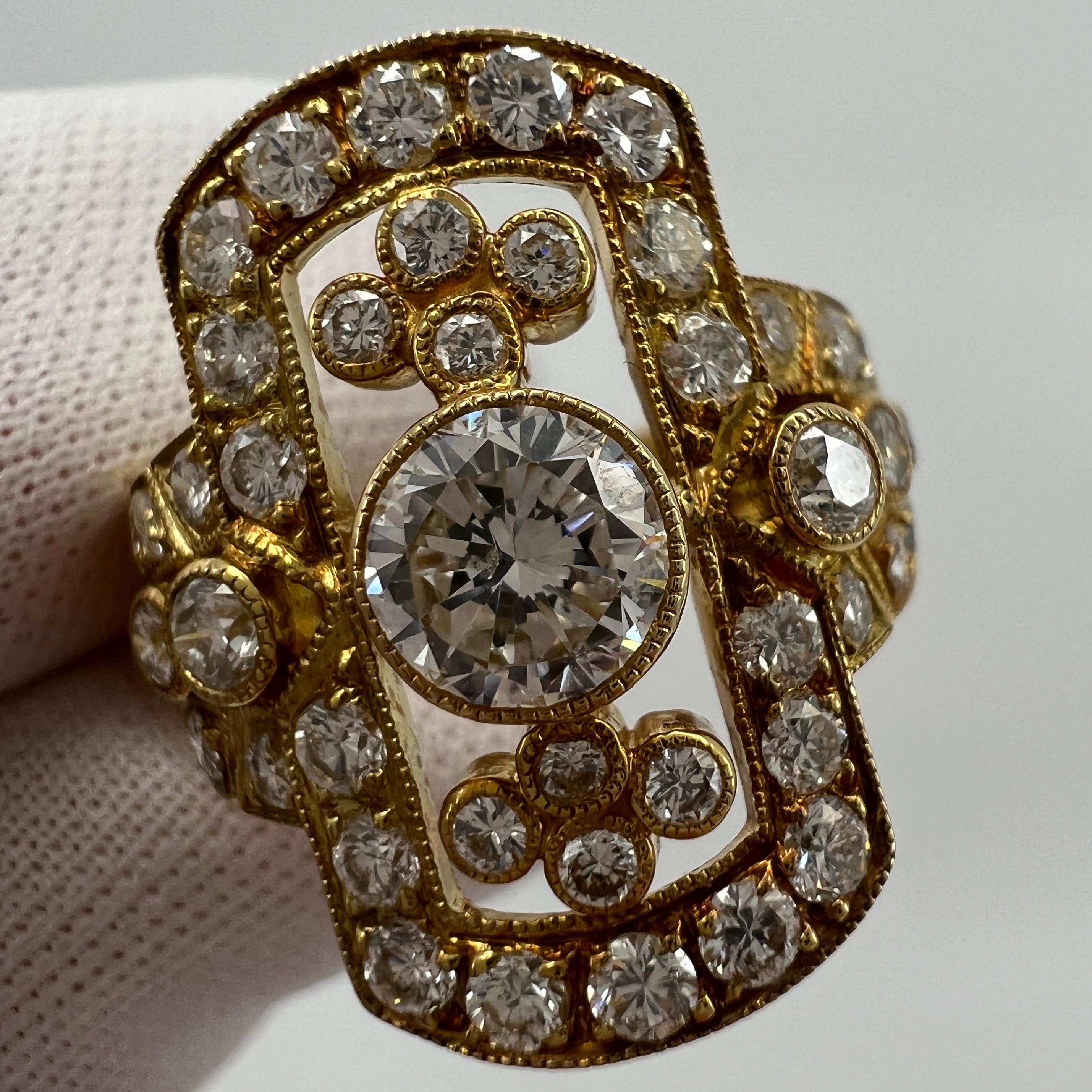 Fine Art Deco Style Diamond Cluster 18k Yellow Gold Handmade Ring.

A beautiful and unique handmade art deco ring with millgrain borders and highlights.

This extravagantly styled ring features 1.702 total carat of white round brilliant cut