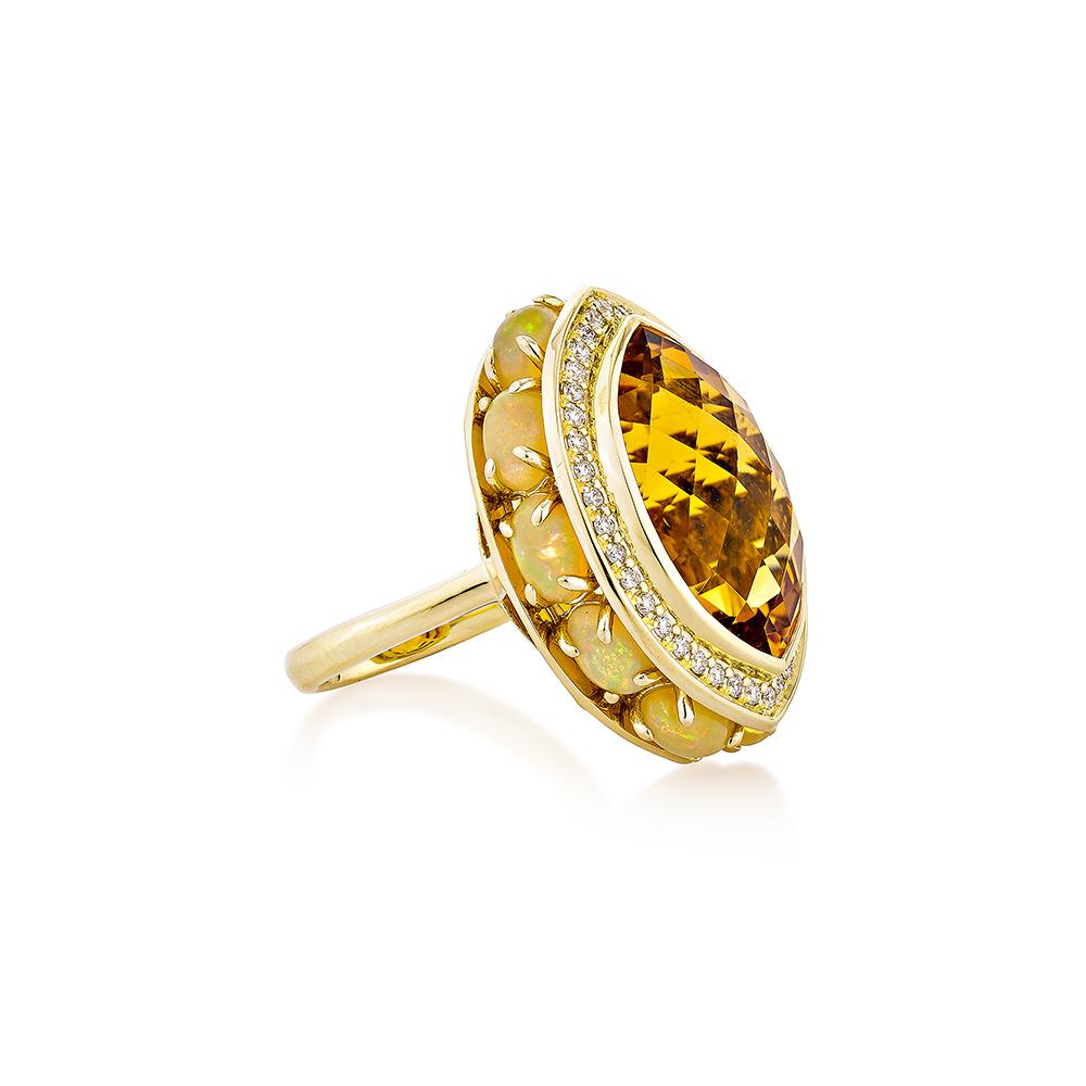 Citrine is natural wonder that come in all shapes and colors. A citrine stone will bring a ray of sunshine into your life! The opals that surround the ring contribute to its beauty and elegance. These lovely stones are wonderful gifts for anyone and