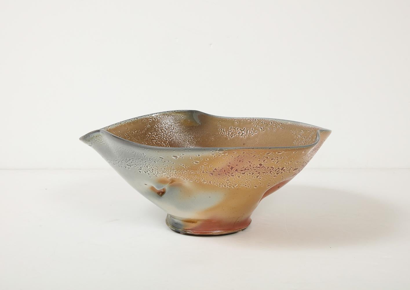 Glazed stoneware. Unique, wood-fired bowl with dimpled surfaces. Artist's cypher stamped on underside.