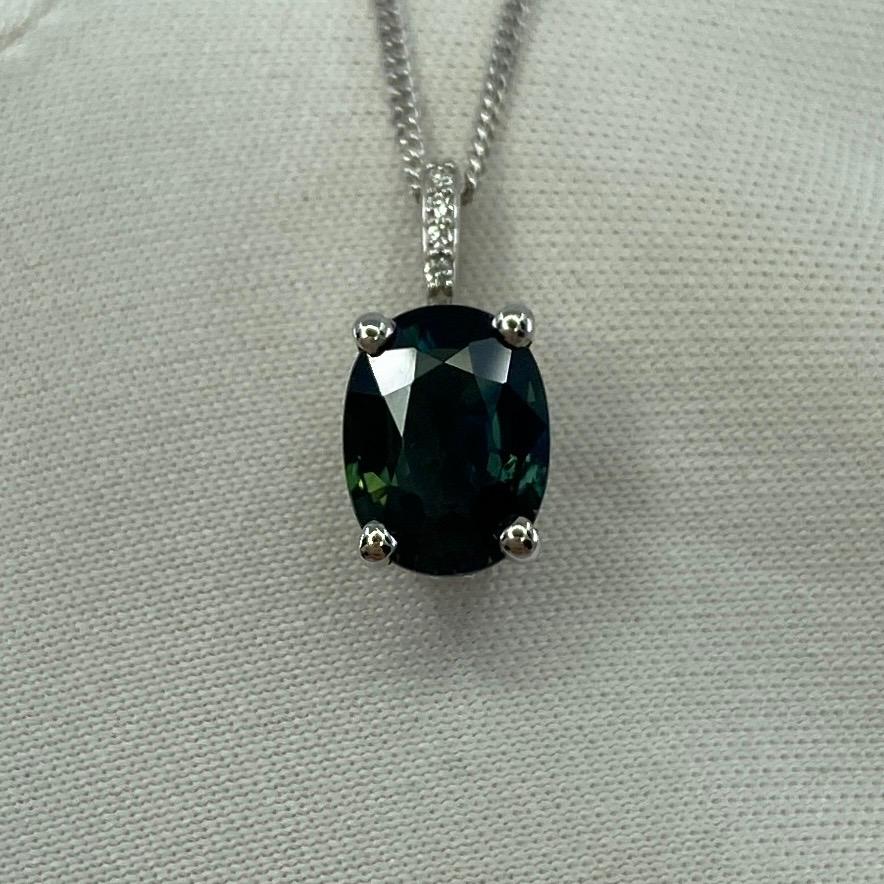 Oval Cut 1.70ct Deep Green Blue Sapphire Oval 18k Gold Diamond Surround Pendant Necklace For Sale