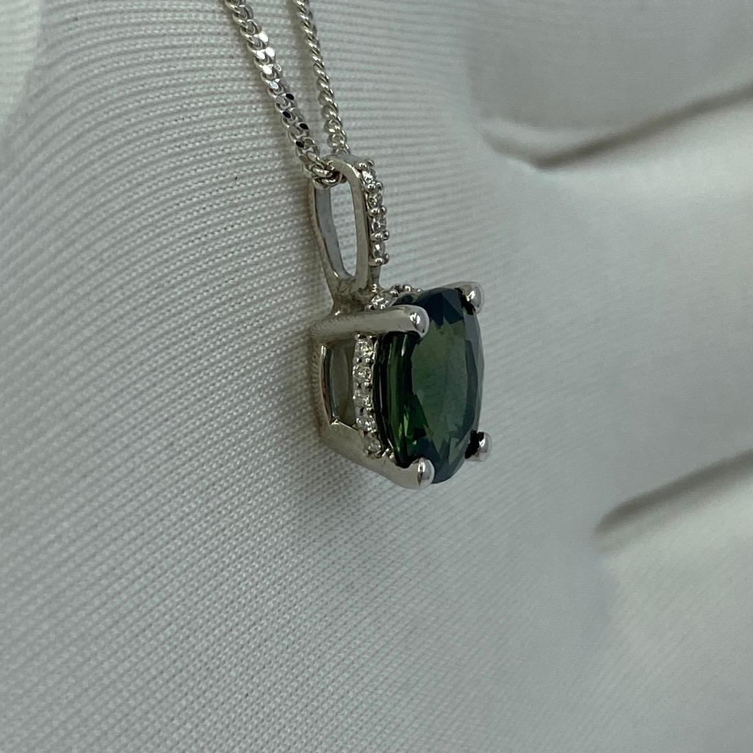 1.70ct Deep Green Blue Sapphire Oval 18k Gold Diamond Surround Pendant Necklace In New Condition For Sale In Birmingham, GB