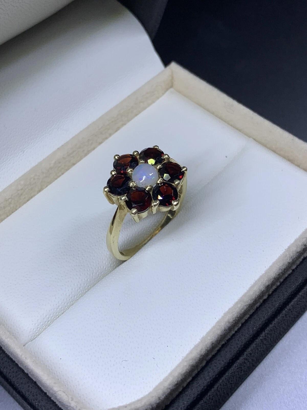 1.70ct Garnet opal engagement ring in 9ct yellow gold.

Beautiful garnet and opal engagement ring in 9k yellow gold antique.

Garnet vivid burgundy colour natural untreated gemstone total weight 1.50ct round shaped.

Opal natural untreated 0.20ct