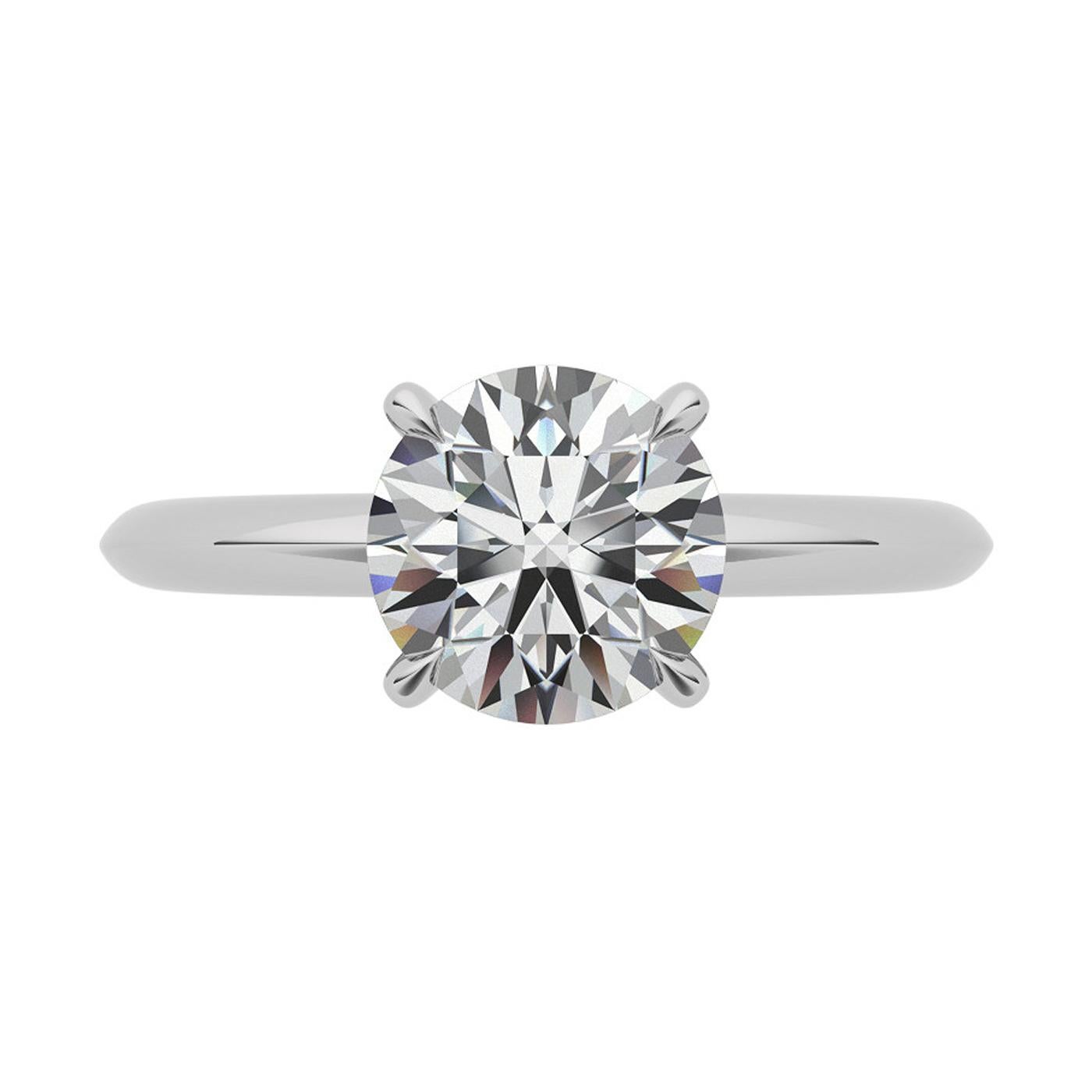 Véritable chef-d'œuvre de design, ce style Tiffany est la bague de fiançailles la plus emblématique au monde. Conçue sans faille, la monture à quatre griffes disparaît pratiquement et permet au diamant brillant de flotter au-dessus de l'anneau et