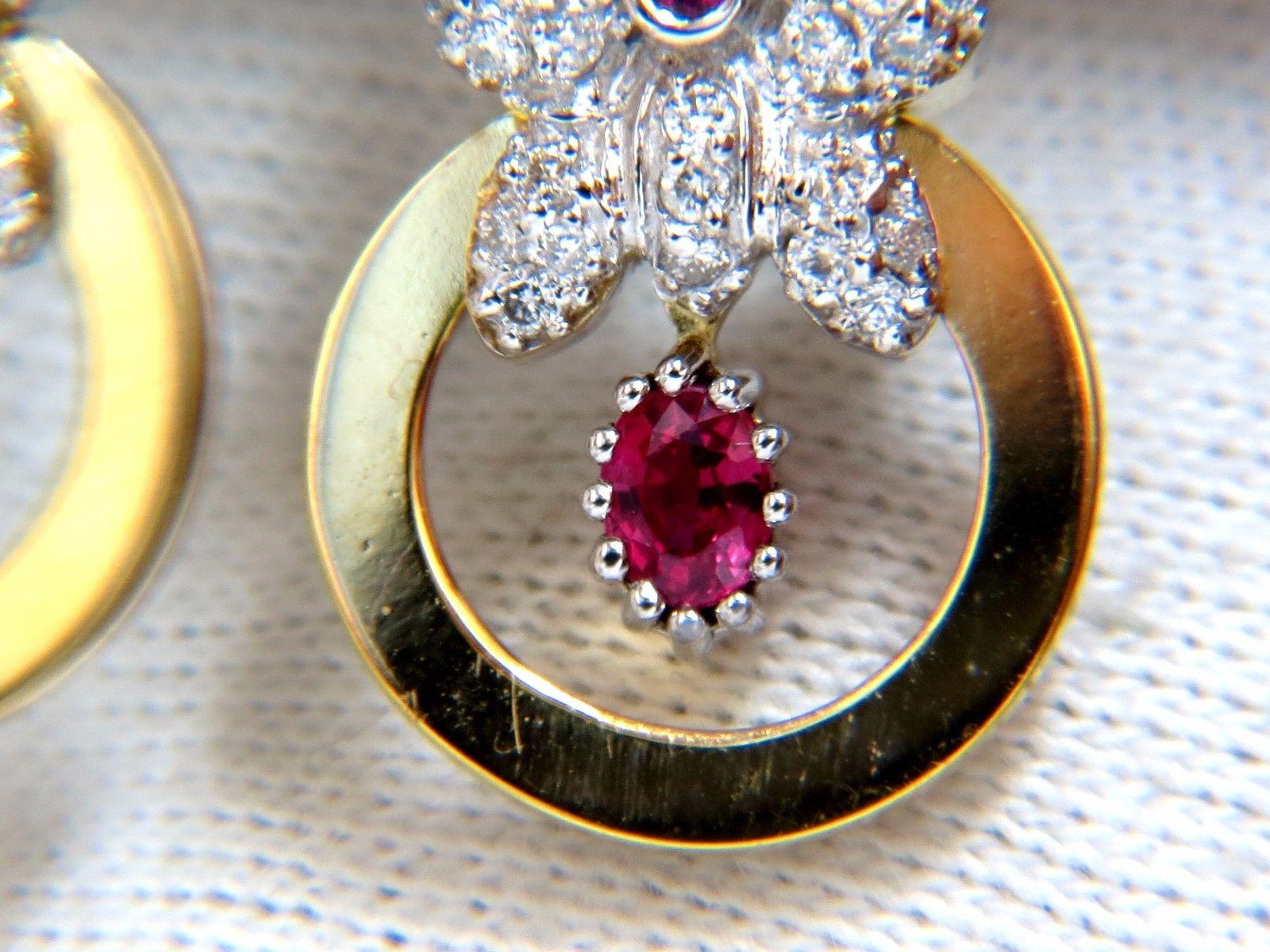 .50ct. Natural Rubies & 1.30ct. diamonds dangle butterfly earrings.

Rubies: oval cut, transparent & clean clarity.

Fully faceted & gorgeous vivid red tone.

1.30cts of Side round diamonds: 

G-color, Vs-2 clarity.

18kt. white gold

10