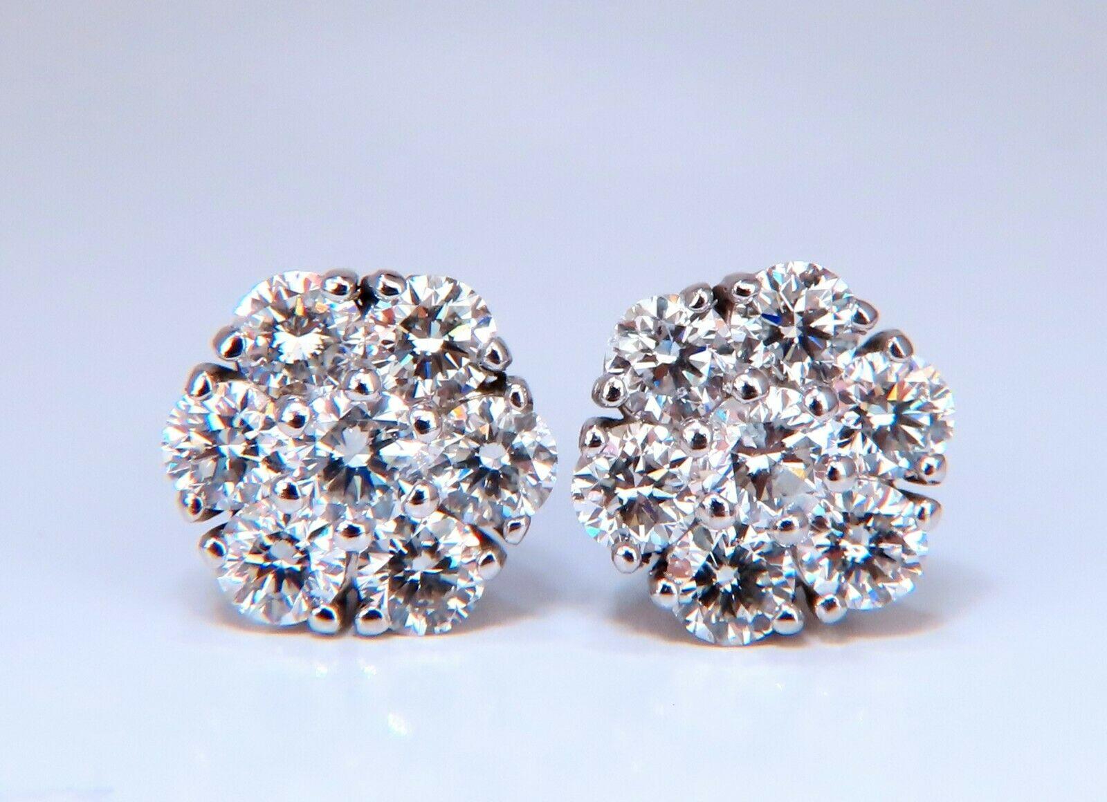 Floreta cluster snowflake diamond earrings.

1.70 carat natural round diamonds

G color vs2 clarity

14 karat white gold 3.6 g

Earrings measure 10mm wide

$,8,000 appraisal certificate to accompany