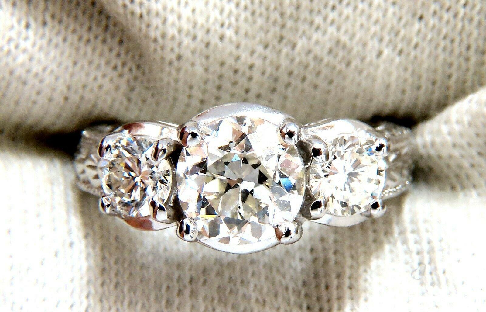 Classic Three Engagement ring

1.70ct. Natural Center Round Brilliant diamond.

Old mine, European Cut

I-color Si-1 clarity 

7.4 x 7.3mm

 

With .77ct (2) Side round diamonds.

I-color si-2 clarity.

14kt white gold

Ring Current size: 6.25

5.6