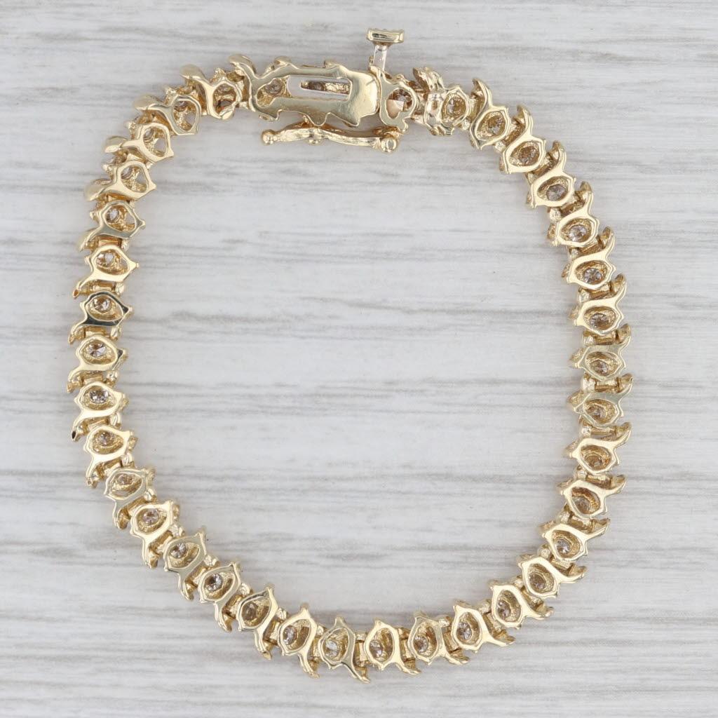 Informazioni sulla gemma:
- Diamanti naturali -
Carati totali - 1,70ctw
Taglio - Brillante rotondo
Colore - H - K.
Chiarezza - I1

Metallo: oro giallo 14k
Peso: 9 grammi 
Timbri: 14k
Stile della catena: Tennis
Chiusura: Scatola
Circonferenza