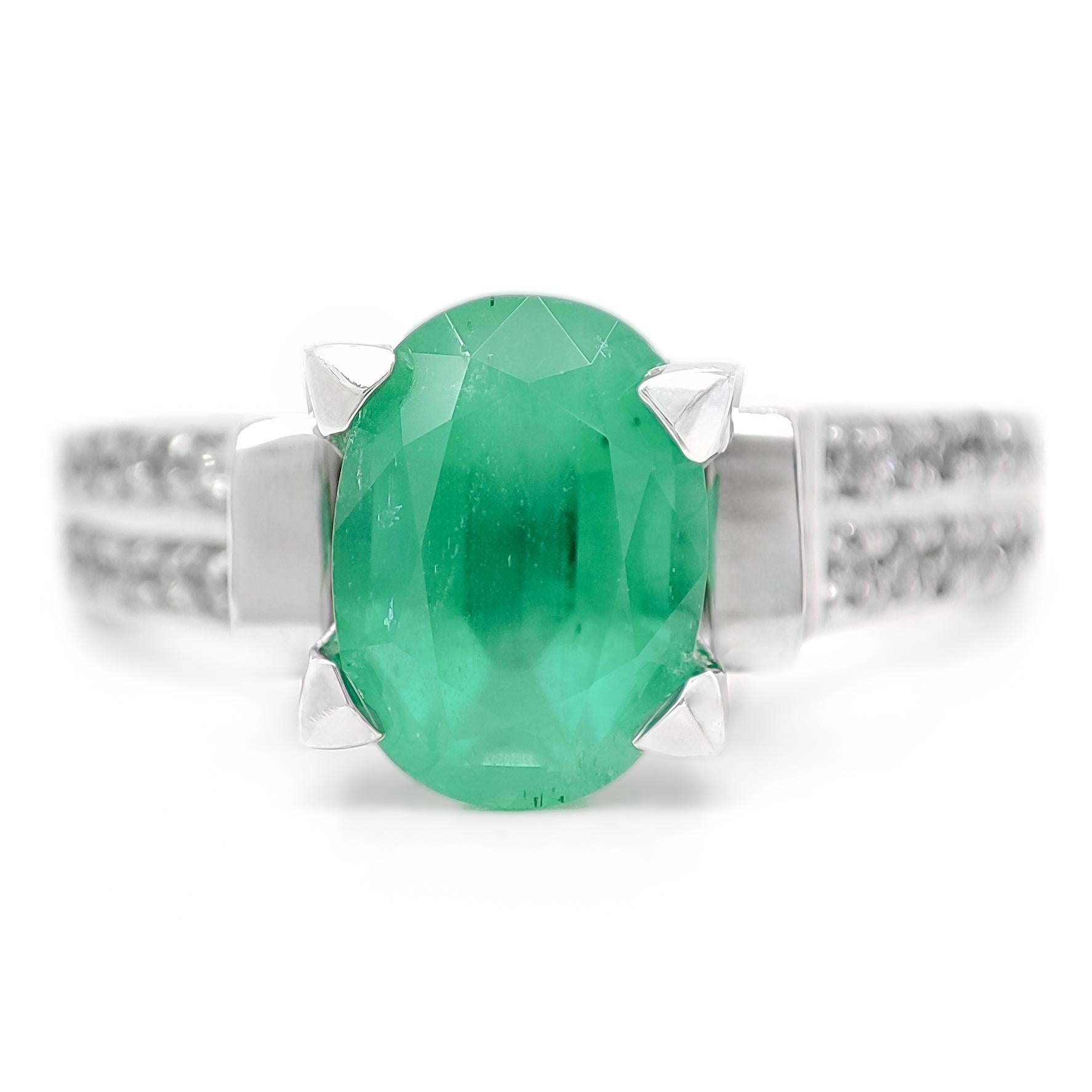 FOR US BUYERS NO VAT

This charming ring features a 1.47-carat green emerald as its focal point, displaying the enchanting green hue that emeralds are known for.

Enhancing the emerald's beauty are 40 diamonds, totaling 0.23 carats. These diamonds