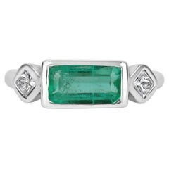 1.70tw 18K Three Stone Colombian Emerald Cut & Princess Cut Diamond Bezel Ring