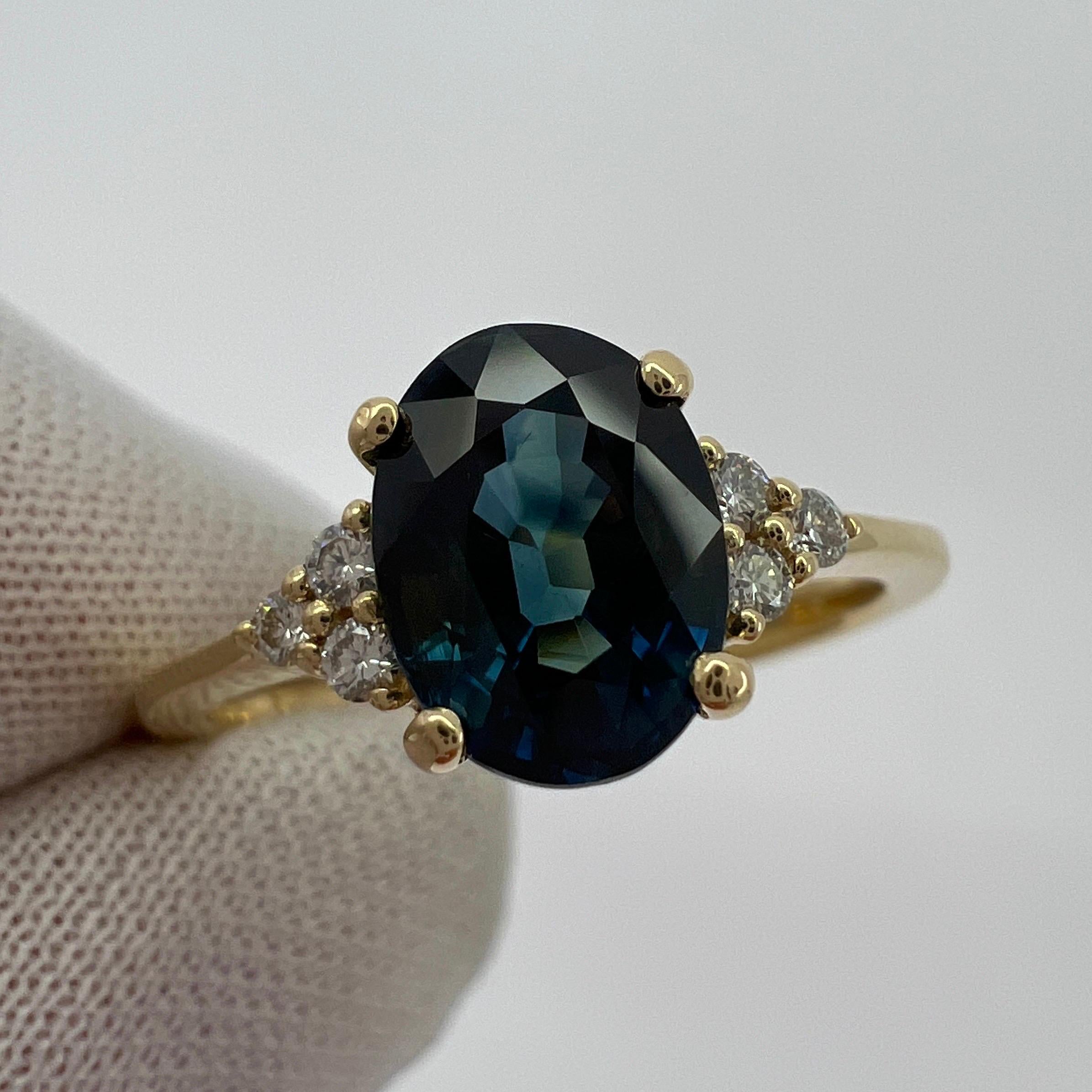 Deep Teal Blue Oval Cut Sapphire & Diamond 18k Yellow Gold Ring.

Fine 1.71 carat sapphire with a beautiful deep teal blue colour.  Also has an excellent oval cut and very good clarity. Measures 8x6mm.

Accented by 3 round brilliant cut diamonds