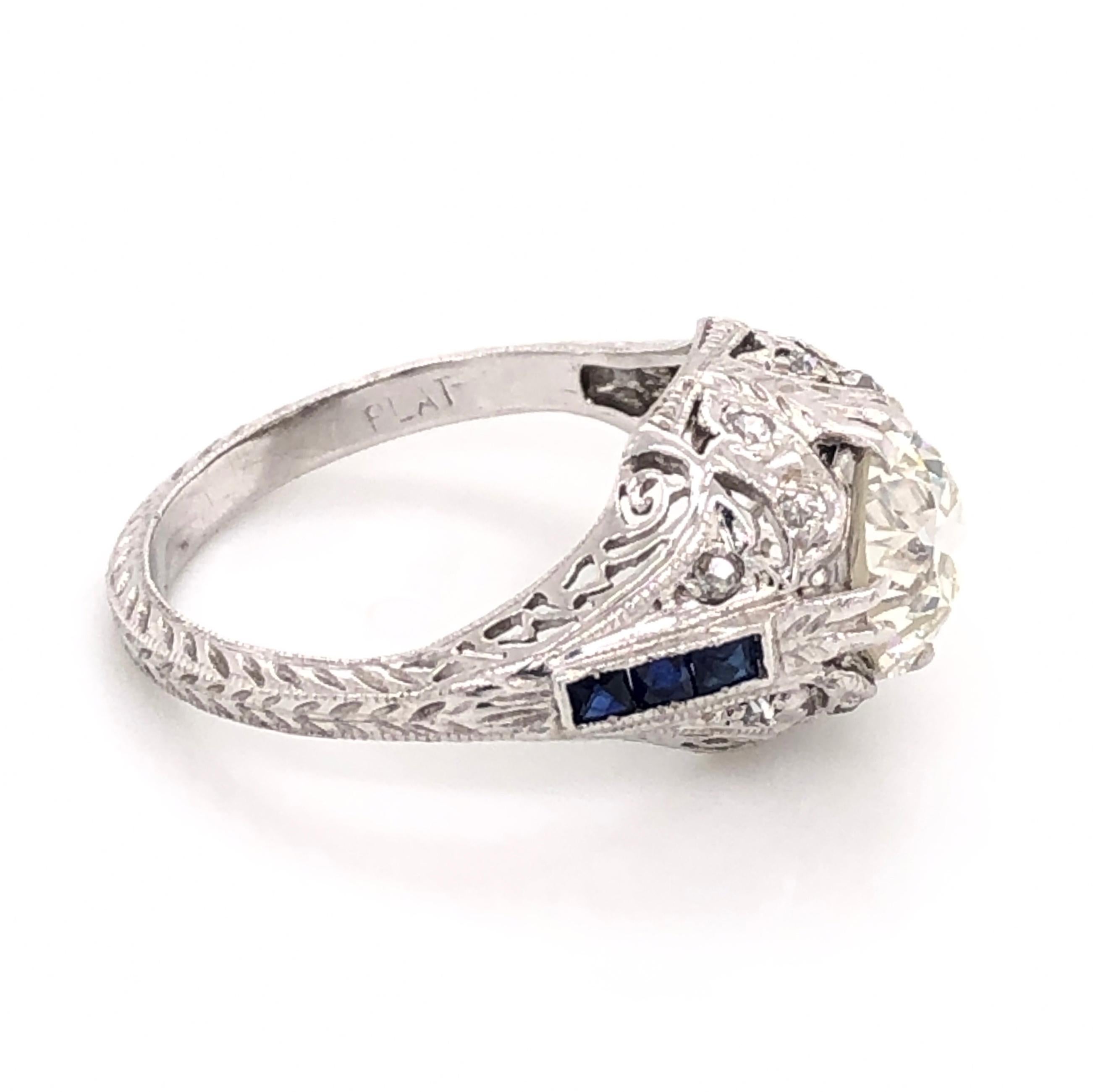 Beautiful, Classic and finely detailed Diamond Art Deco style Cocktail Ring, securely nestled center set with an Old European Cut Diamond weighing approx. 1.71 Carat. GIA certified VS1 Clarity, L Color. Accent Diamonds along with milgrain detailing