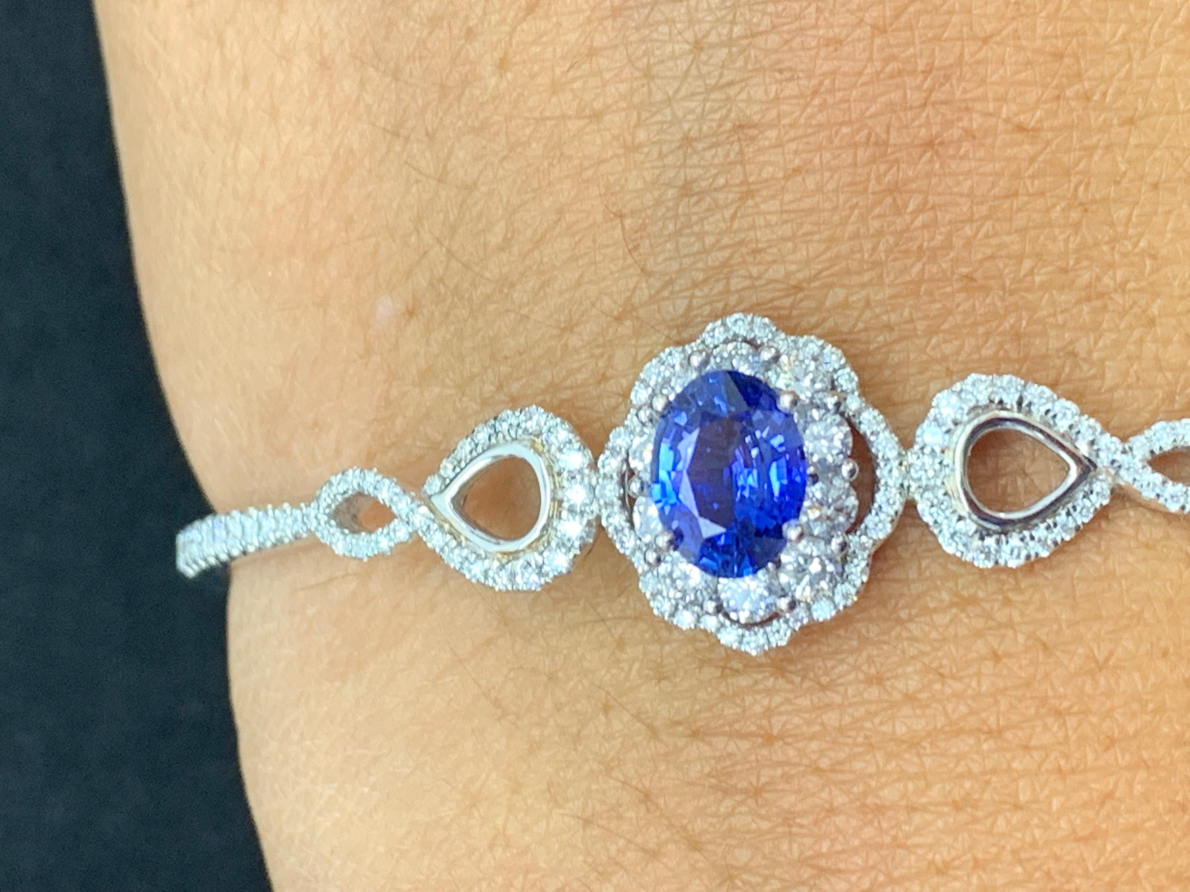A unique and fashionable Sapphire bangle showcasing an openwork design set with 1.71 carat of Sapphire and 124 brilliant diamonds weighing 1.39 carat in total.  Made in 18k white gold.

Style available in different price ranges. Prices are based on