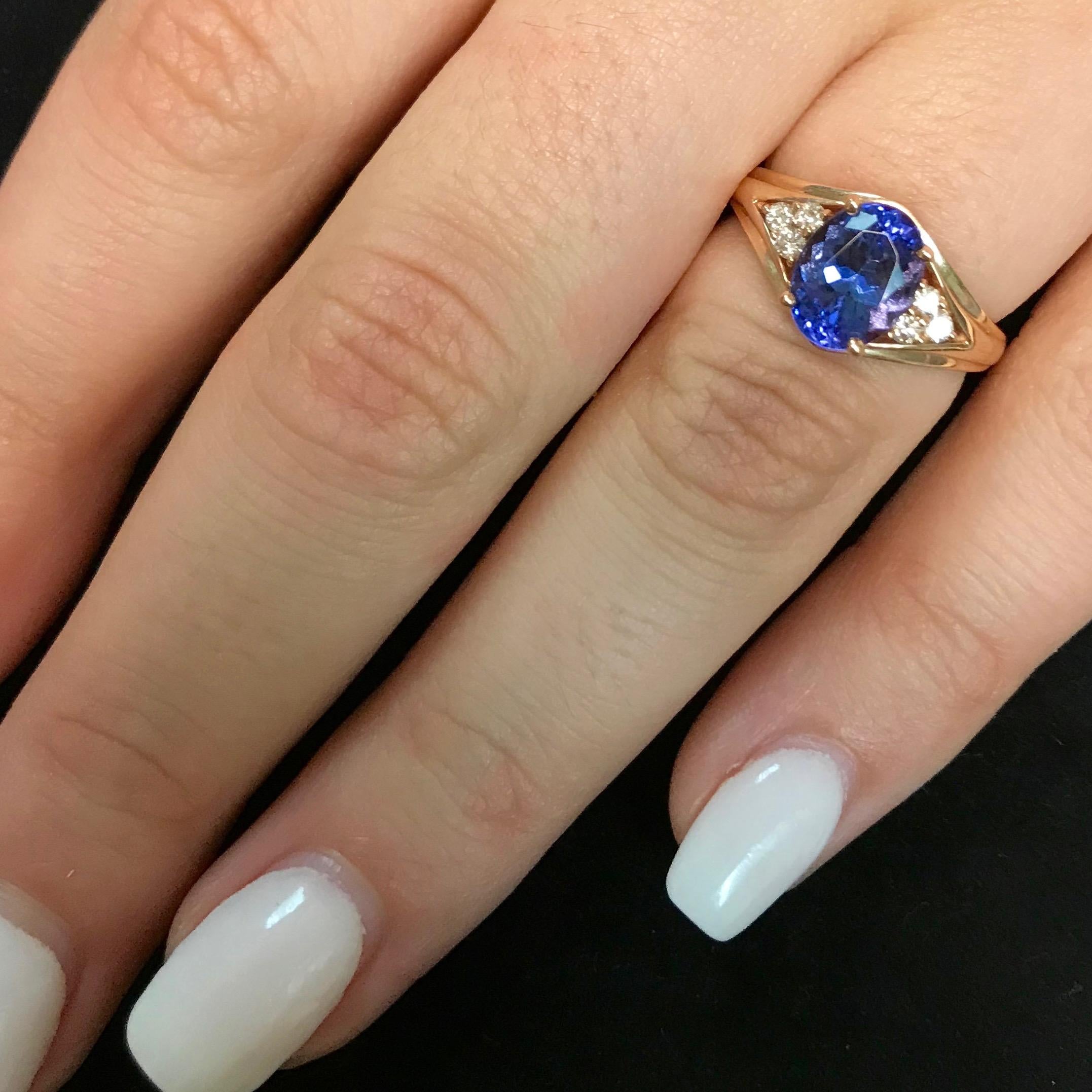 Contemporary 1.71 Carat Oval Shaped Natural Tanzanite 0.13 Carat Diamond Ring 14K Rose Gold For Sale