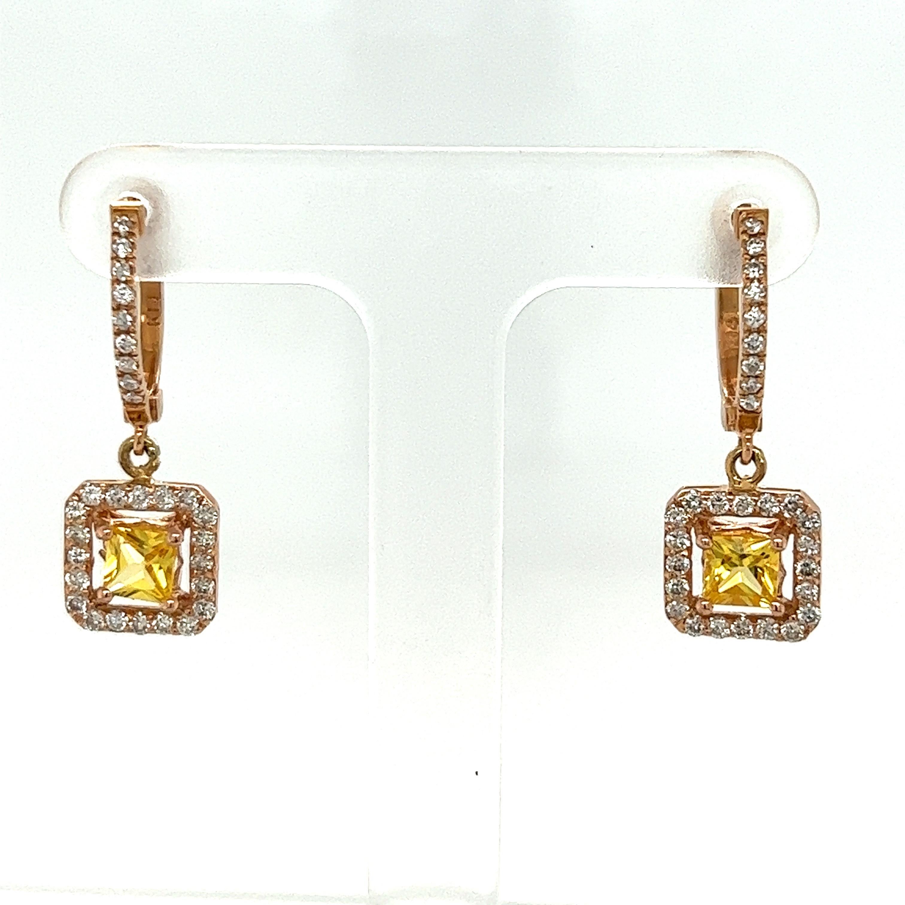These earrings have Square Cut Yellow Sapphires that weigh 1.11 carats and measure at approximately 4 mm x 4 mm. There are Round Cut Diamonds that weigh 0.60 carats. The total carat weight of the earrings are 1.71 carats. The diamond clarity and