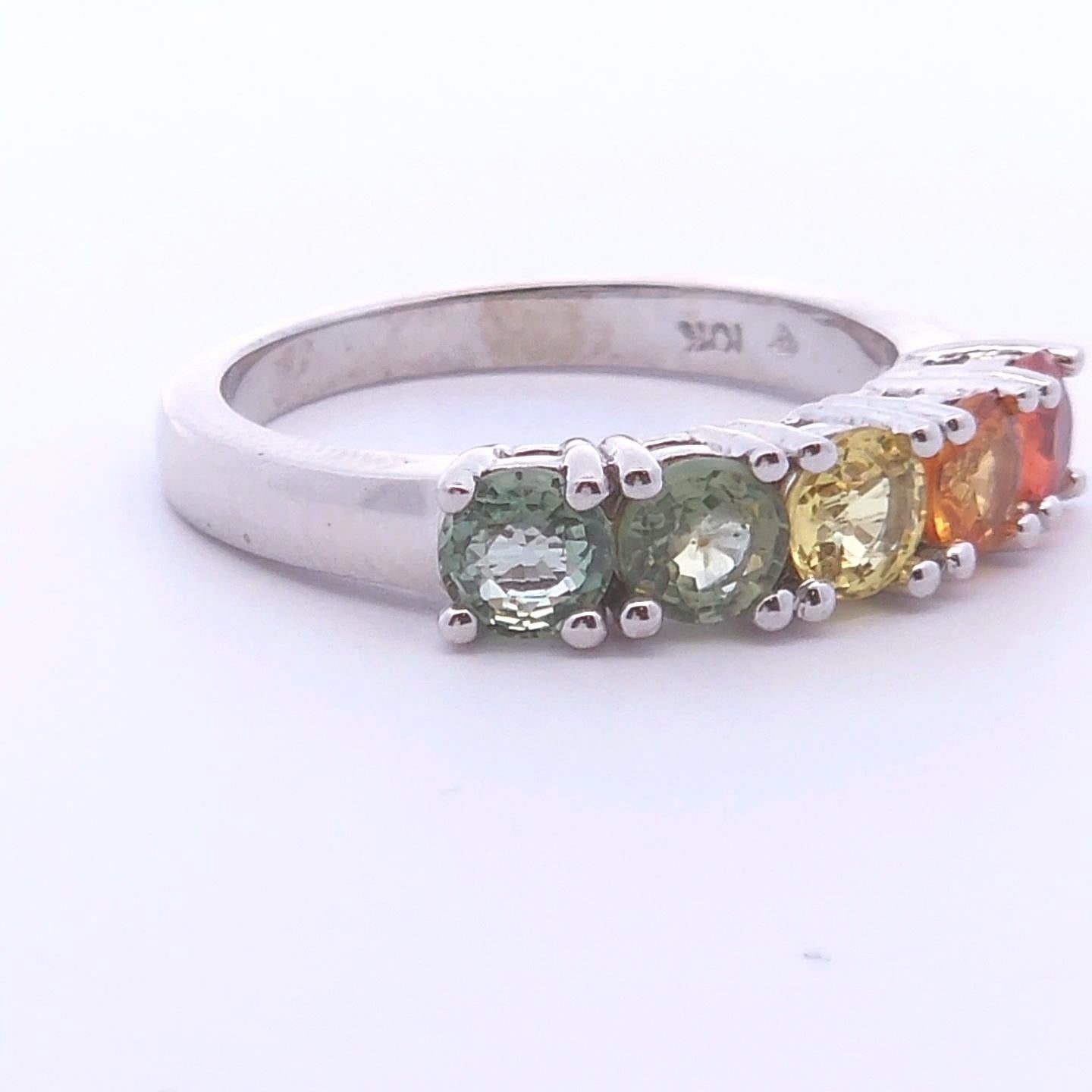 Luxury, at the right price.

This unique ring has a 1.71 carat total weight. The five-stone anniversary band features red, orange, yellow, green, and blue sapphires creating a cascading rainbow set in 10K white gold.

This ring is set at a size