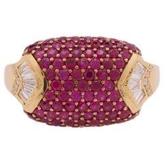 1.710 carats of round-cut rubies with Baguette and Diamond Ring in 18 Karat Gold