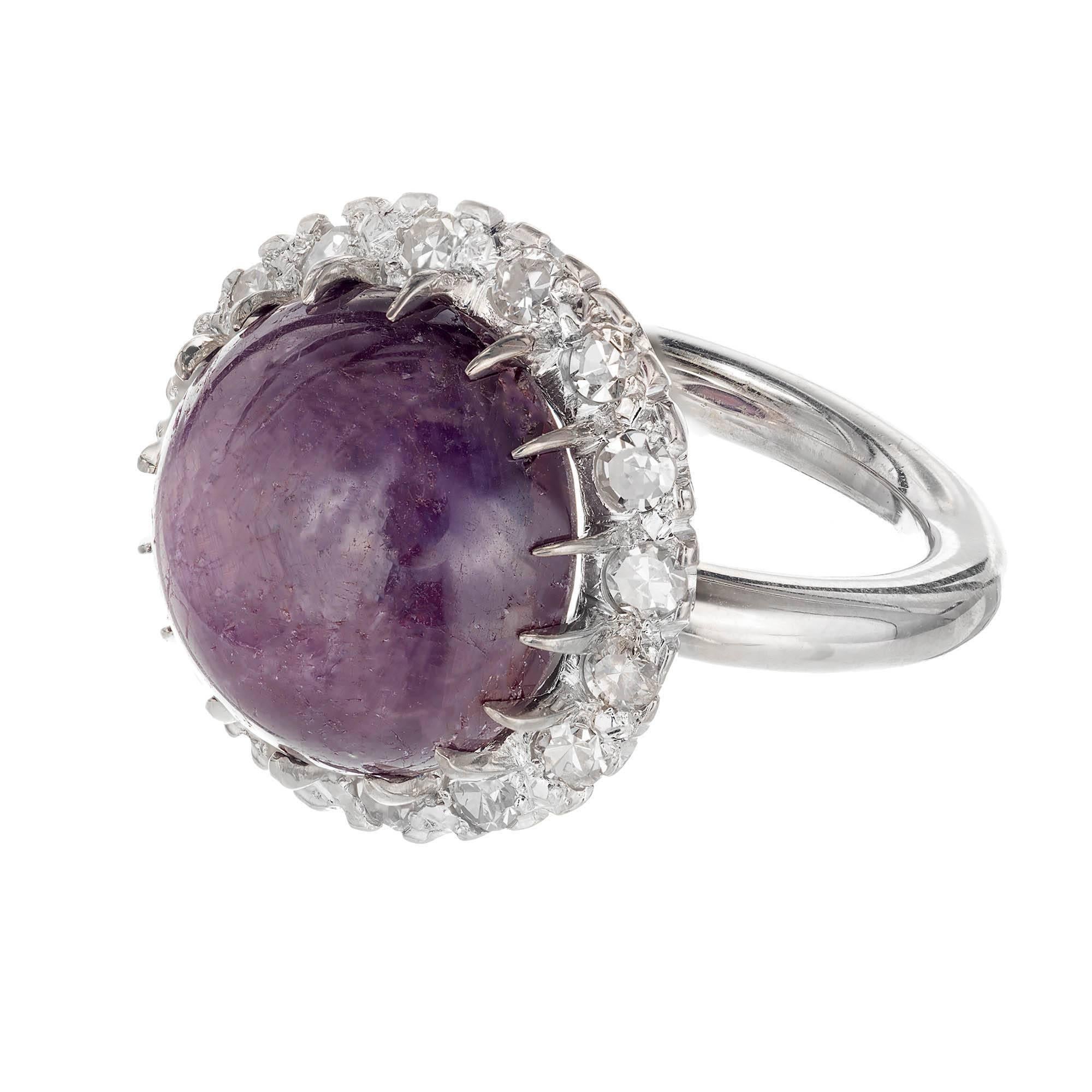 Captivating vintage 1940s natural star sapphire and diamond cocktail engagement ring. 17.15cts deep purple sapphire in its original 14k white gold diamond halo setting. GIA certified untreated star sapphire. this is a difficult stone to photograph,