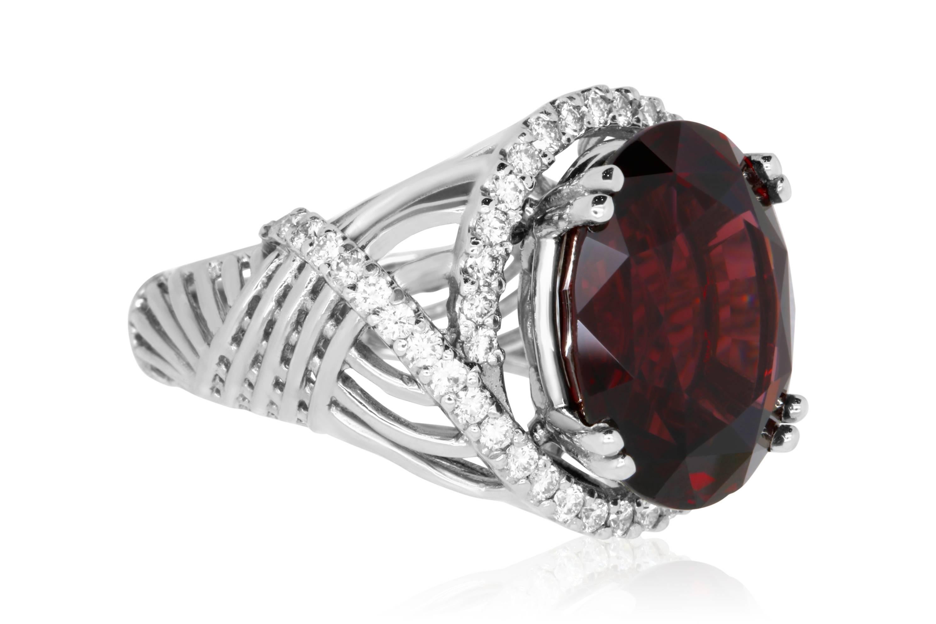 Material: 14k White Gold 
Center Diamond Details: 17.16 Carat Oval Rhodolite Garnet - Measuring 16.9 x 14.2 mm
Mounting Diamond Details: 50 Round White Diamonds Approximately 0.9 Carats - Clarity: VS-SI / Color: H-I
Ring Size: Size 6.75 (can be