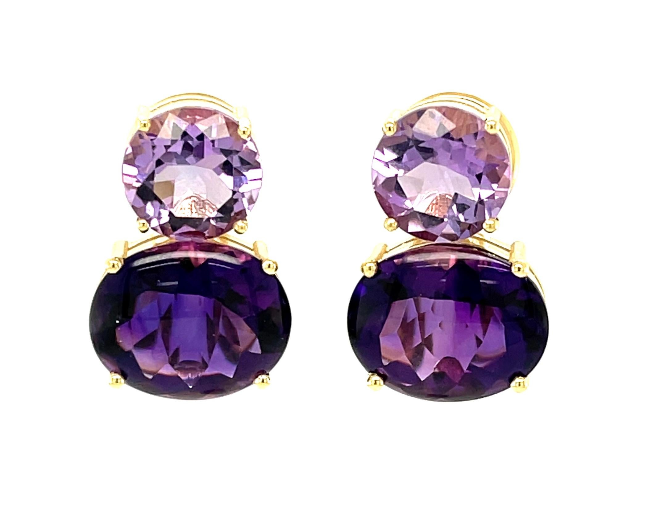 These pretty earrings feature amethyst gemstones in two different shades of purple! The round amethysts sparkle with delicate 