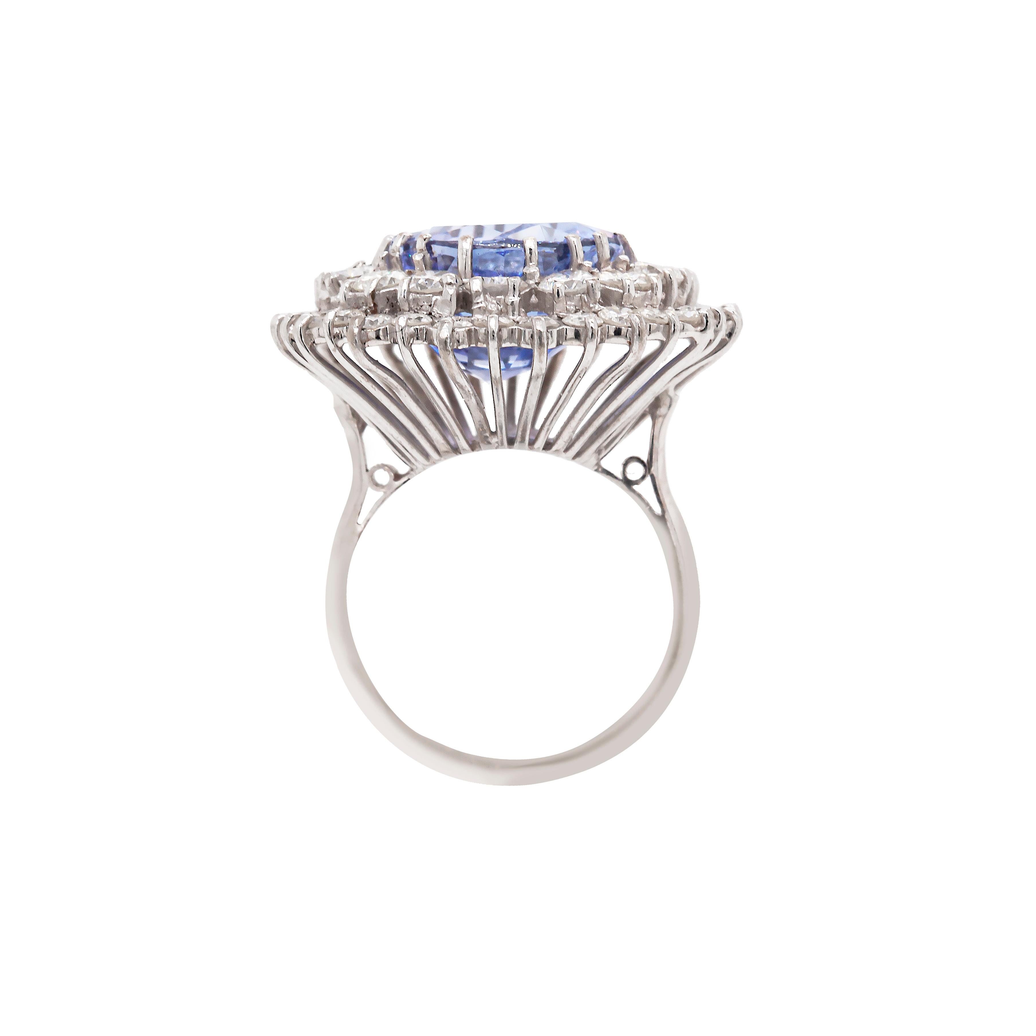 Finely crafted in 18 carat white gold, this cocktail cluster ring is a fantastic work of art sure to make a lasting impression, not least because of its gorgeous natural colour change sapphire which takes centre stage.

At its heart sits an