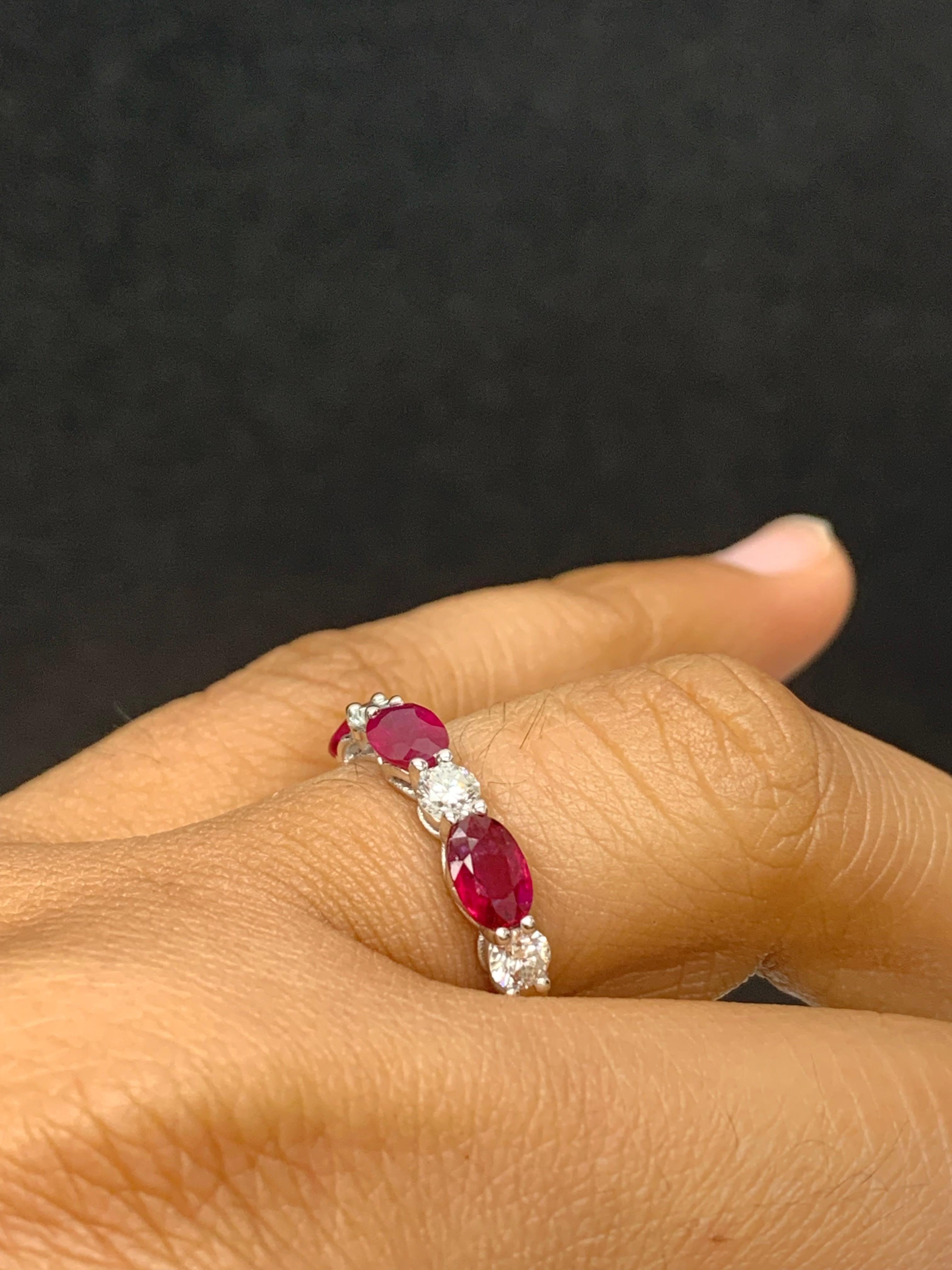 Handcrafted to perfection; showcasing color-rich oval cut rubies that elegantly alternate round diamonds in a 14k white gold setting. 
The 3 rubies weigh 1.71 carats total and 4 diamonds weigh 0.61 carats total.

Size 6.5 US (Sizable). One of a Kind