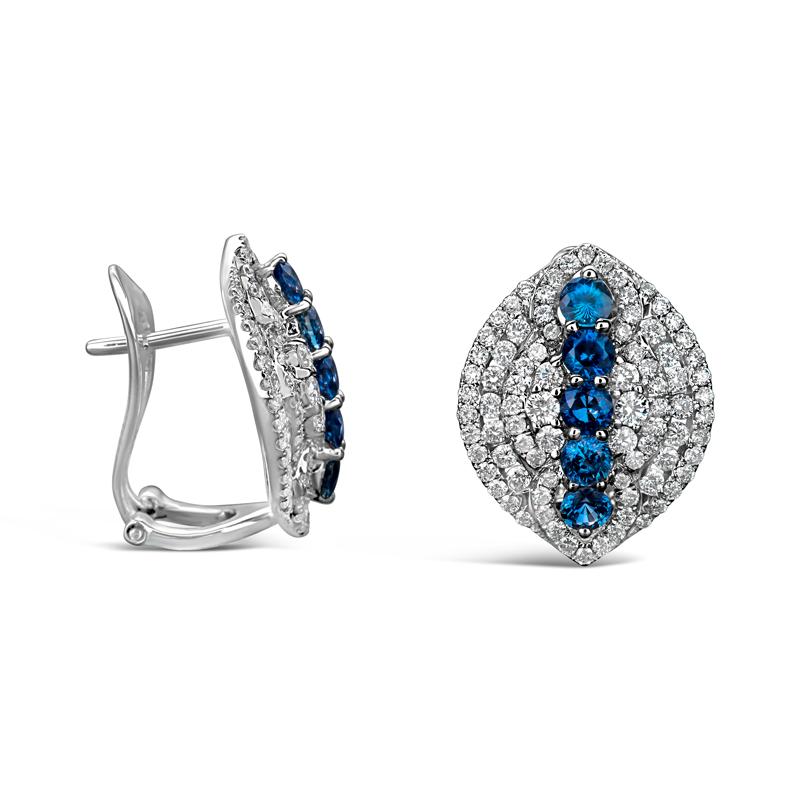 These beautiful and unique earrings feature 1.71 carat total weight in round blue prong- set sapphires surrounded by 1.71 carat total weight in round brilliant diamonds set in 18 karat white gold. French clip back. 
Measurements: 19.74 x