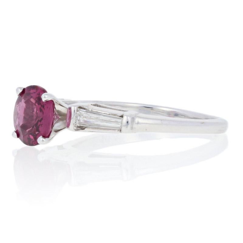 This ring is a size 6 1/4.

Metal Content: Guaranteed 14k Gold as stamped

Stone Information: 
Genuine Spinel
Color: Reddish Purple  
Cut: Round
Diameter: 6.9mm
Carat: 1.31ct 

Natural Diamonds  
Clarity: VS1 - VS2
Color: G - H  
Cut: