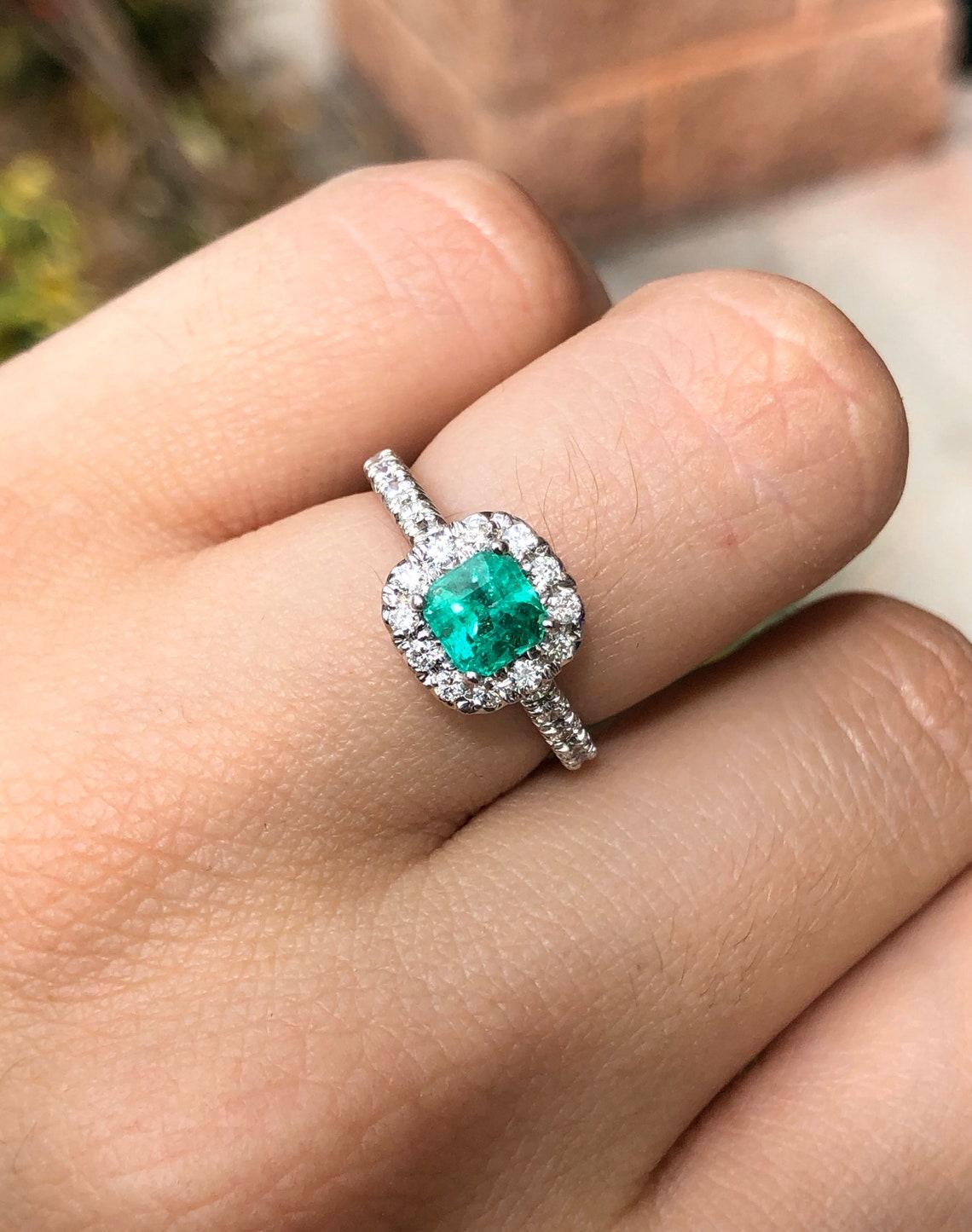 engagement ring with emerald accents