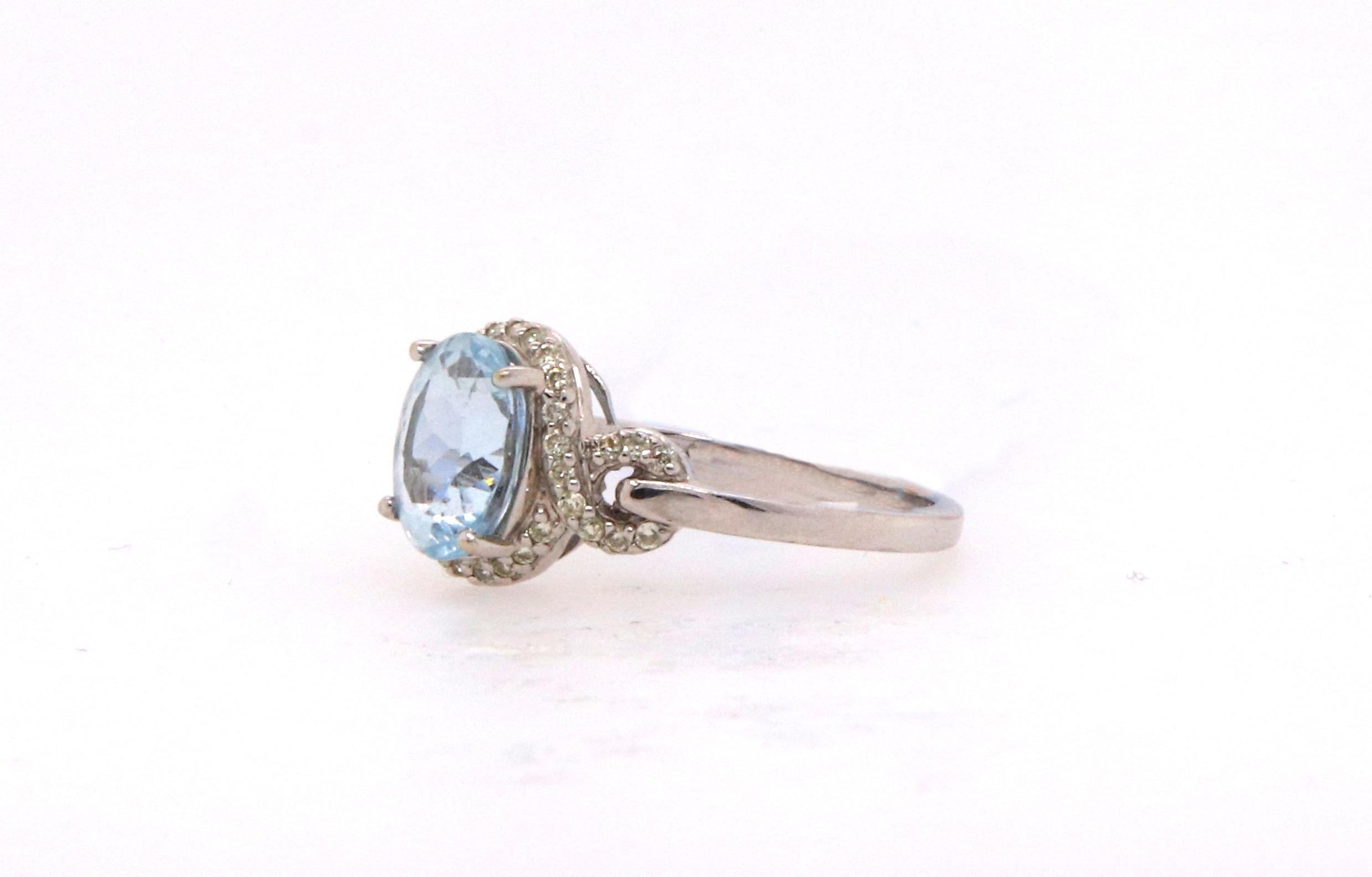 Material: 14k White Gold 
Center Stone Details: 1.72 Carat Oval Shaped Aquamarine - Measuring 9 x 7 mm
Diamond Details: 36 Brilliant Round White Diamonds at Approximately 0.23 Carats - Clarity: SI / Color: H-I
Size 8.25. Complimentary sizing on all