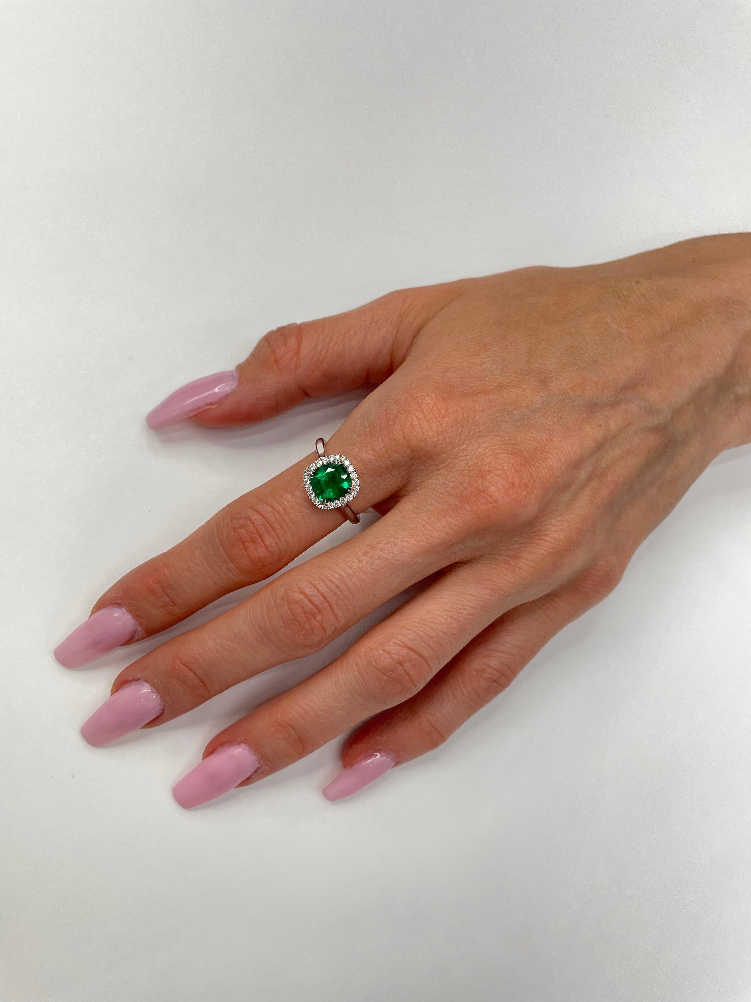 A 1.72ct Cushion cut Green Emerald set in 18K white Gold + 24 round brilliant G-H color, VS clarity = 0.20cttw