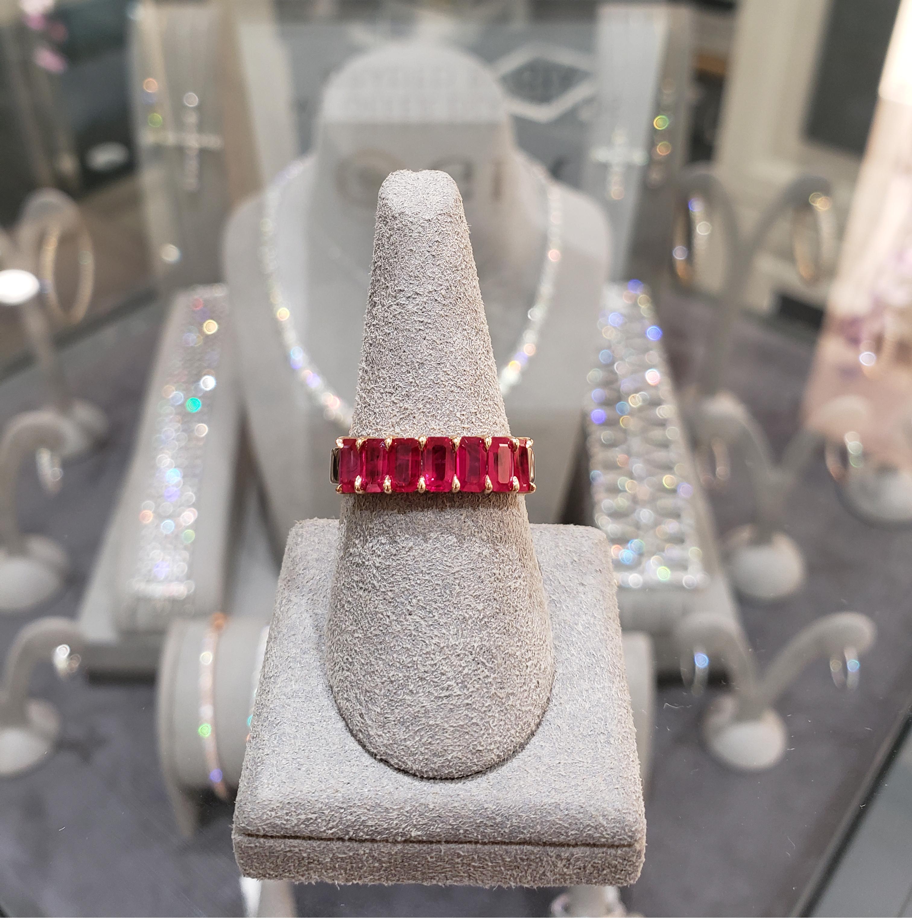 Features a seven-stone wedding band ring with vibrant emerald cut rubies weighing 1.72 carat total. Set in a shared prong, Made with 18K Rose Gold, size 6 US and resizable upon request. 

Roman Malakov is a custom house, specializing in creating