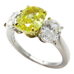 1.72 Carat Fancy Vivid Orangey Yellow Oval Cut Diamond Ring