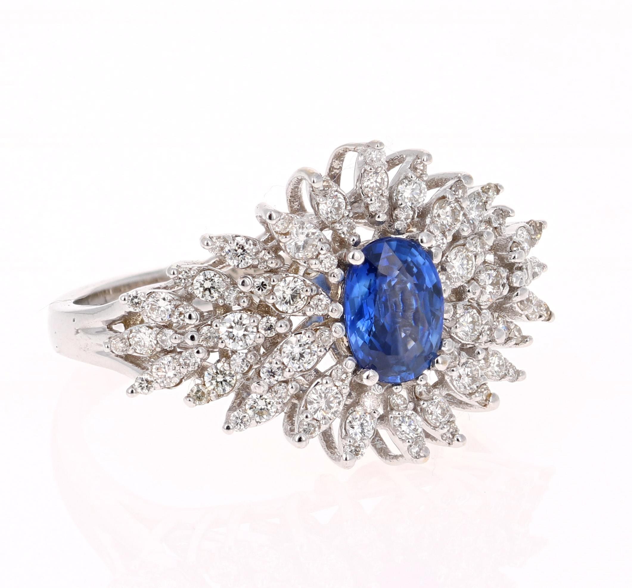 Cute and uniquely designed Oval Cut Sapphire and Diamond Cluster ring that is sure to elevate your accessory collection!  The Sapphire weighs 1.00 carats and is surrounded by 90 Round Cut Diamonds that weigh 0.72 carats.  
This ring is made in 14K
